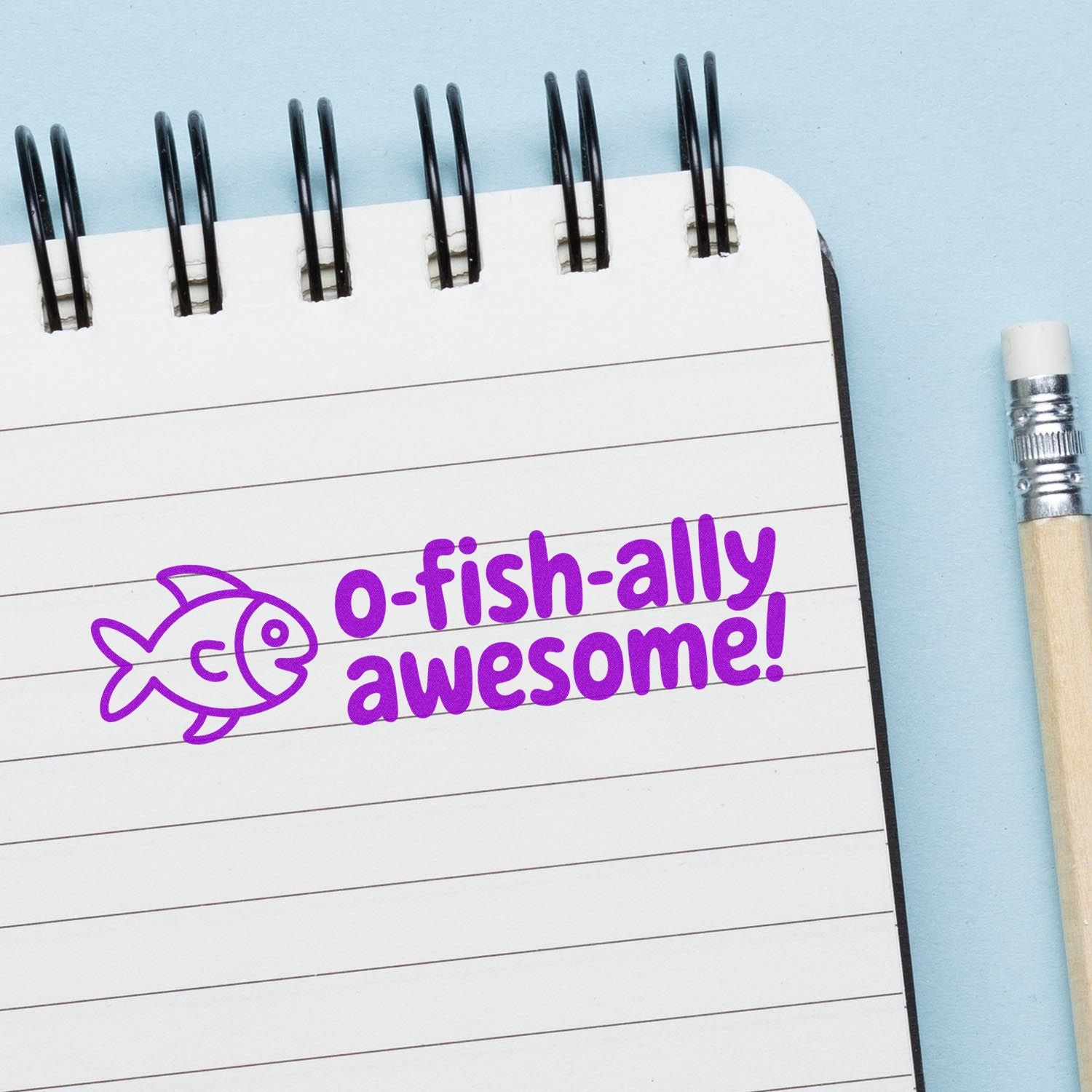 O-fish-ally awesome fish rubber stamp on notebook, ideal for school, craft, and reward stamping.