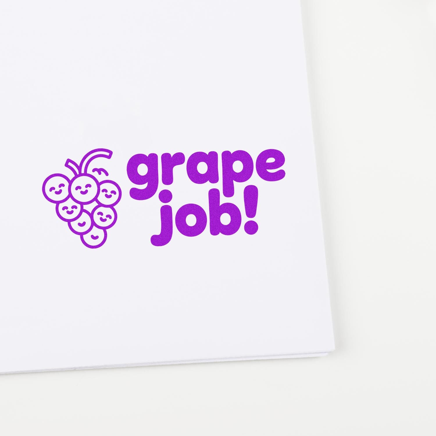 Purple grape job rubber stamp imprint with smiling grape icon, ideal for teacher rewards, classroom crafts, and praise.
