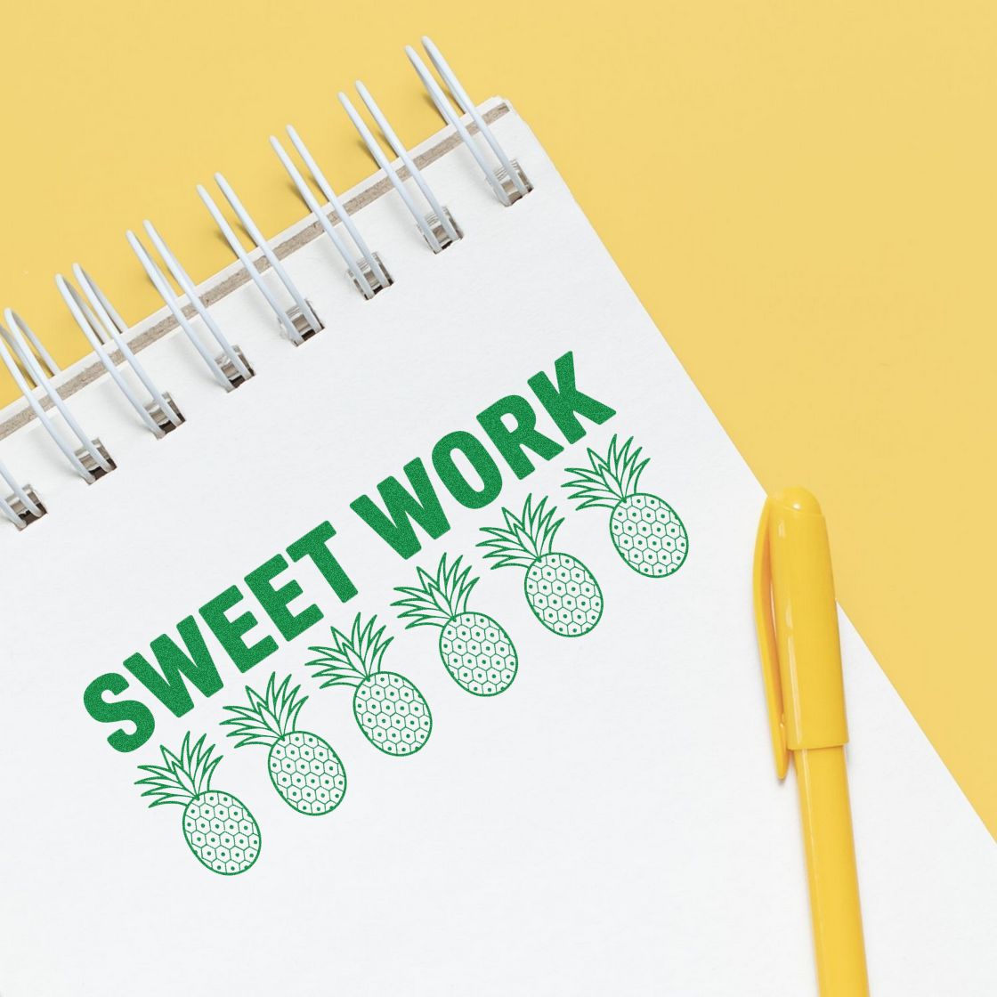 Sweet Work pineapple rubber stamp design in a notebook, ideal for teacher rewards, planners, and craft projects.