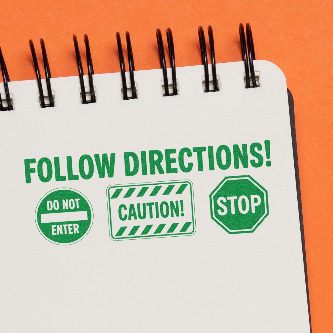 Rubber stamp design with Follow Directions text, do not enter, caution, and stop symbols on notebook paper