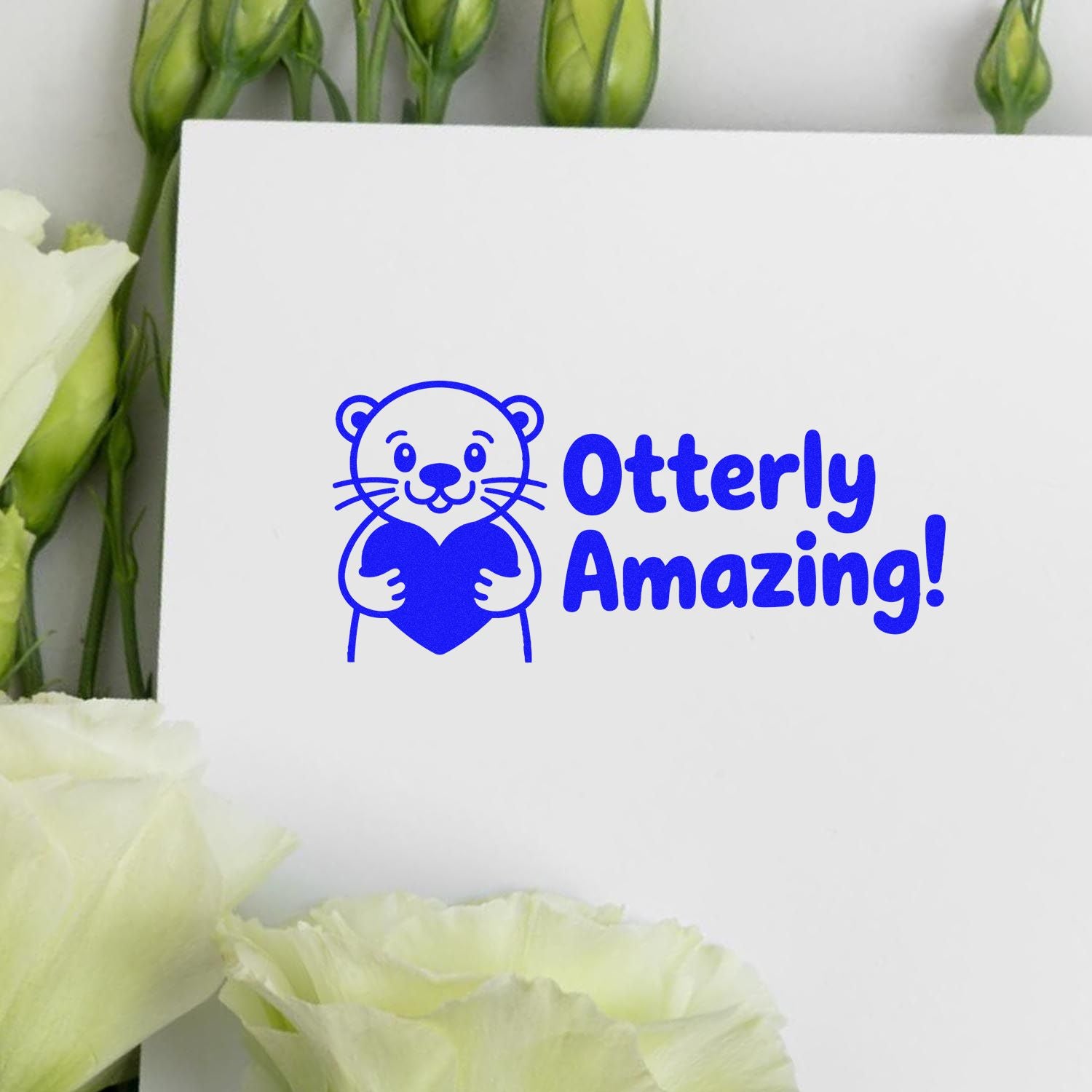 Otterly Amazing rubber stamp design with cute otter holding a heart, perfect for handmade cards and craft projects.