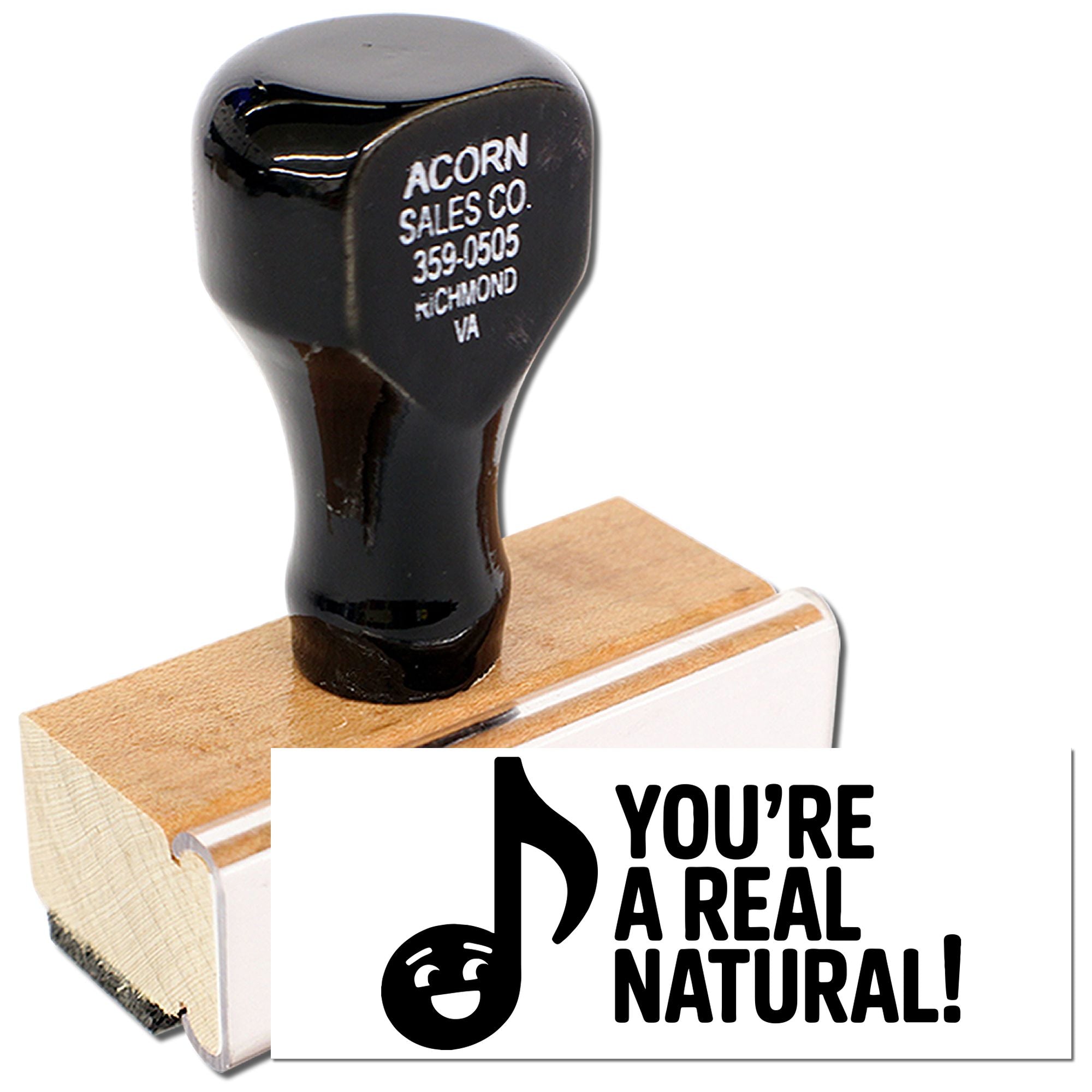 Decorative rubber stamp with Youre a Real Natural! music note design on a wooden block.