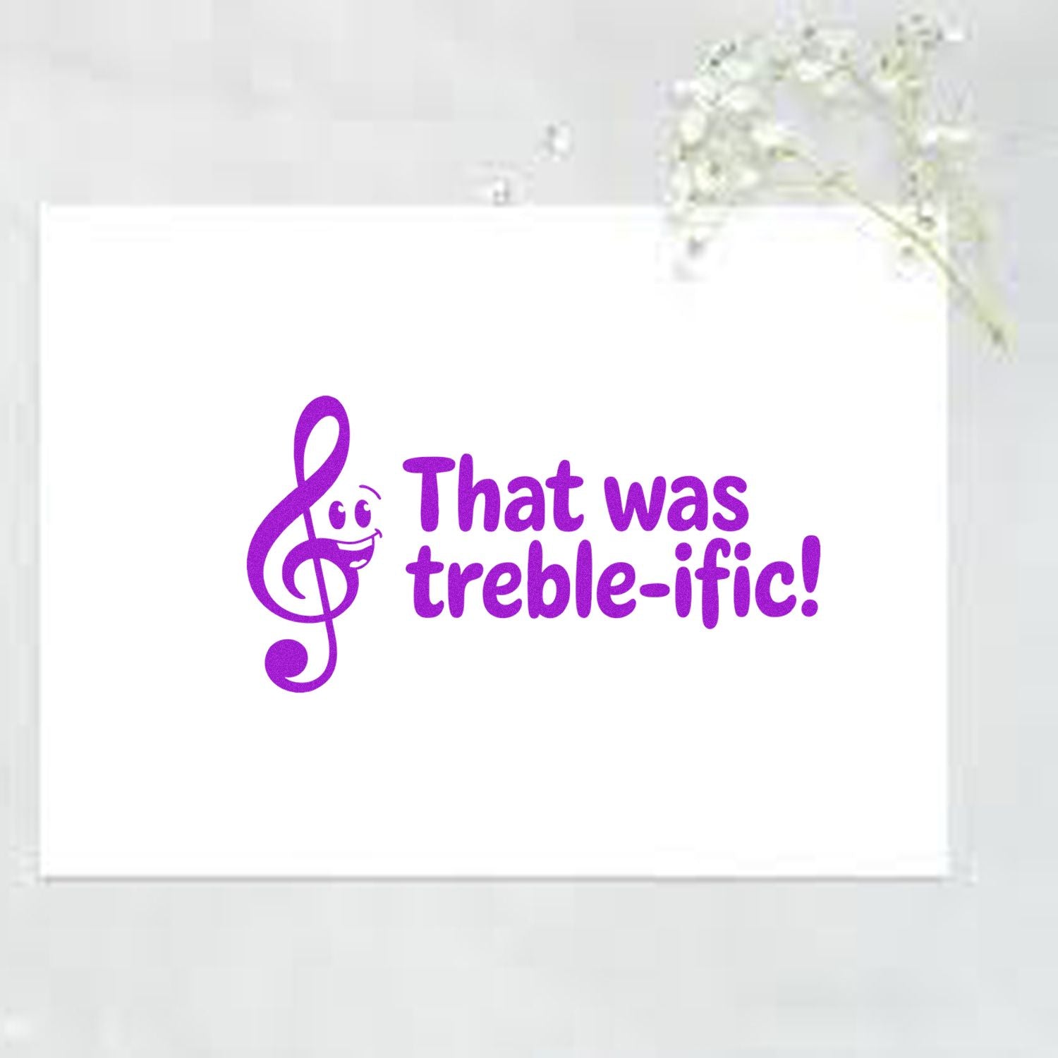 Music rubber stamp design with purple treble clef and pun text That was treble-ific! for card making.