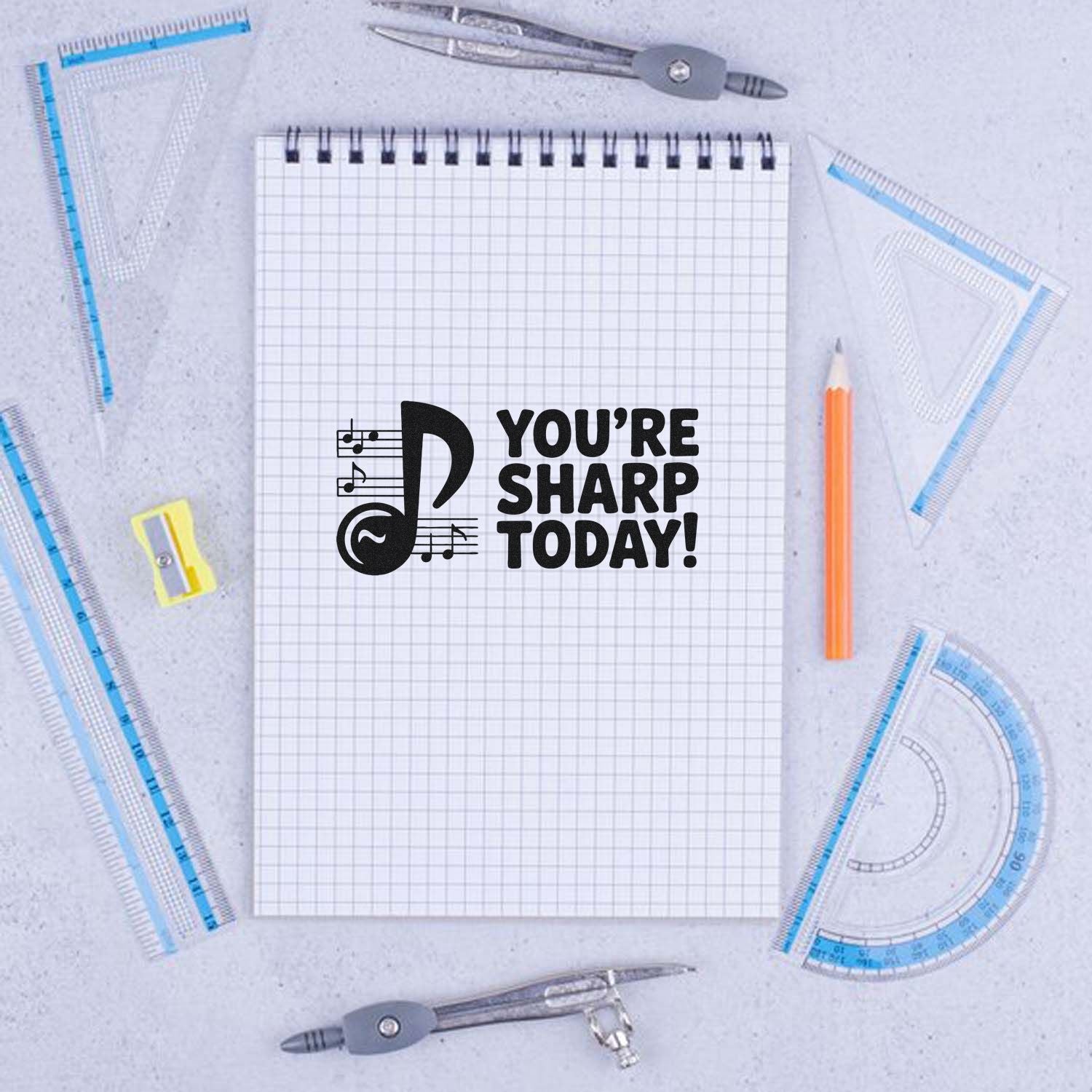 Rubber stamp design reading Youre Sharp Today! with music note, perfect for teacher praise and school stamp projects.