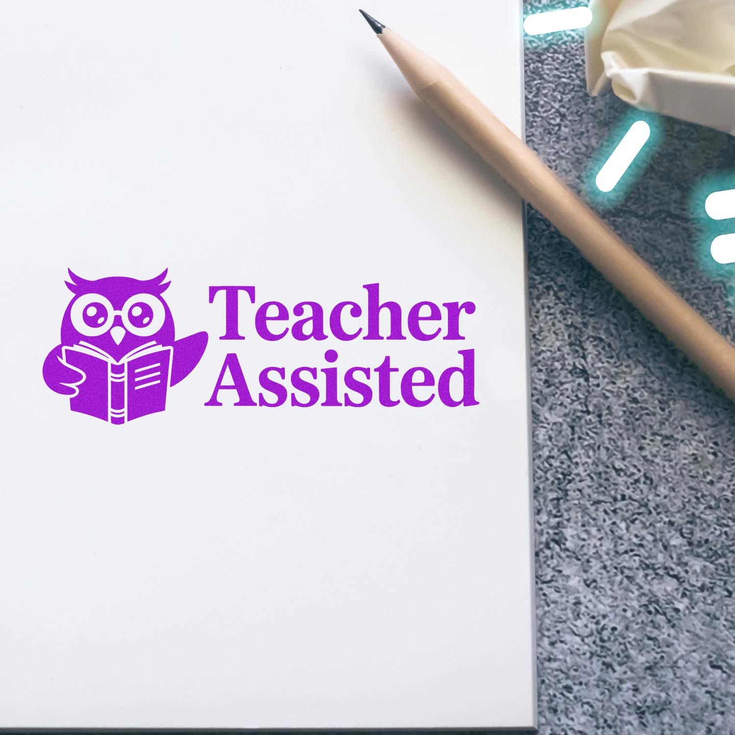 Purple Teacher Assisted rubber stamp with owl icon for classroom paperwork and grading.