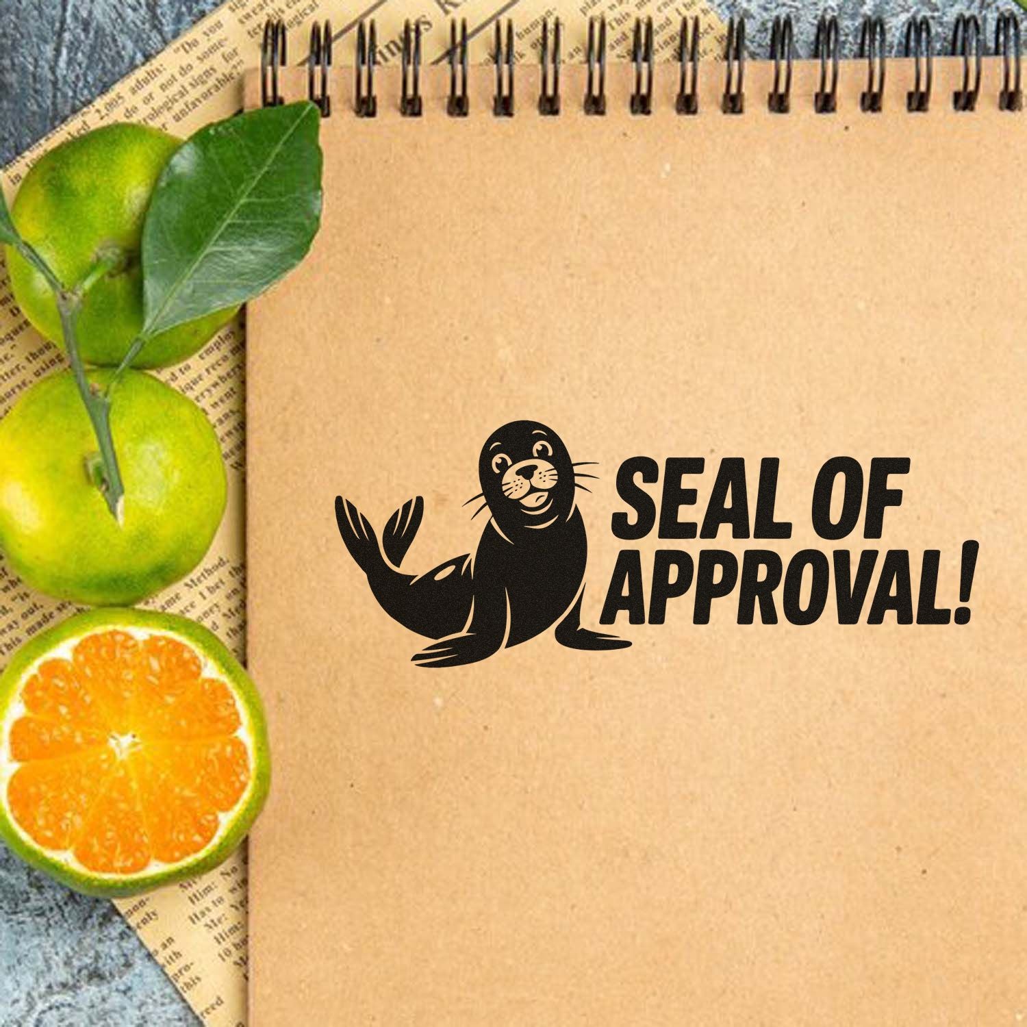 Seal of Approval rubber stamp design with seal illustration on kraft notebook, styled with citrus and leaves.