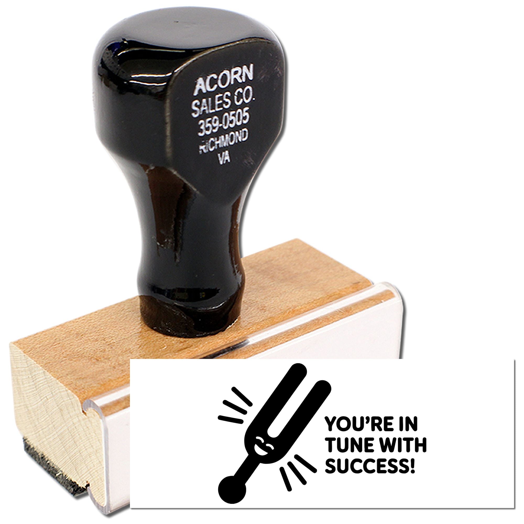 Custom business rubber stamp for Acorn Sales Co. with Youre in tune with success! logo on wooden mount.