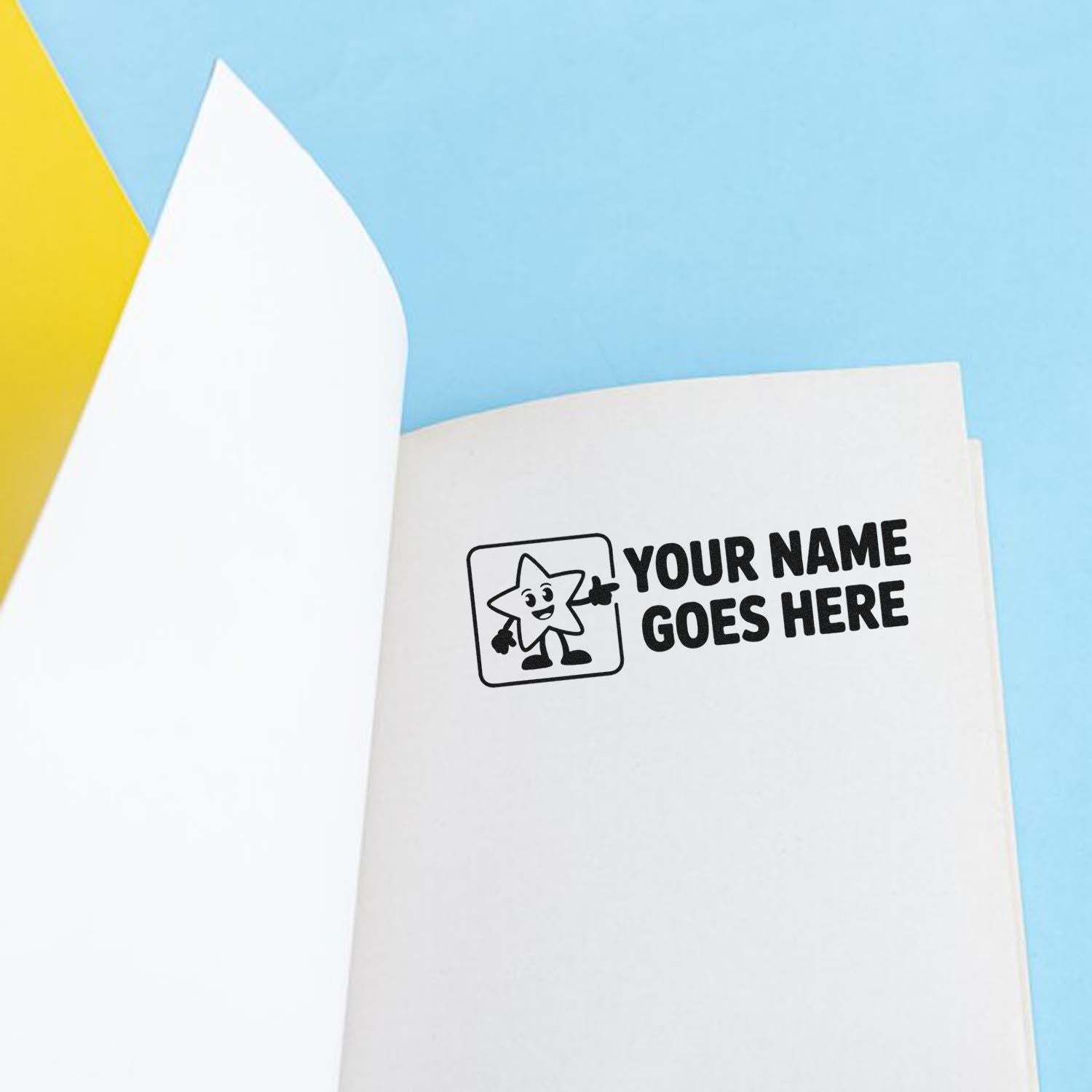 Custom rubber stamp with personalized name placeholder on notebook paper, ideal for branding school supplies and stationery.
