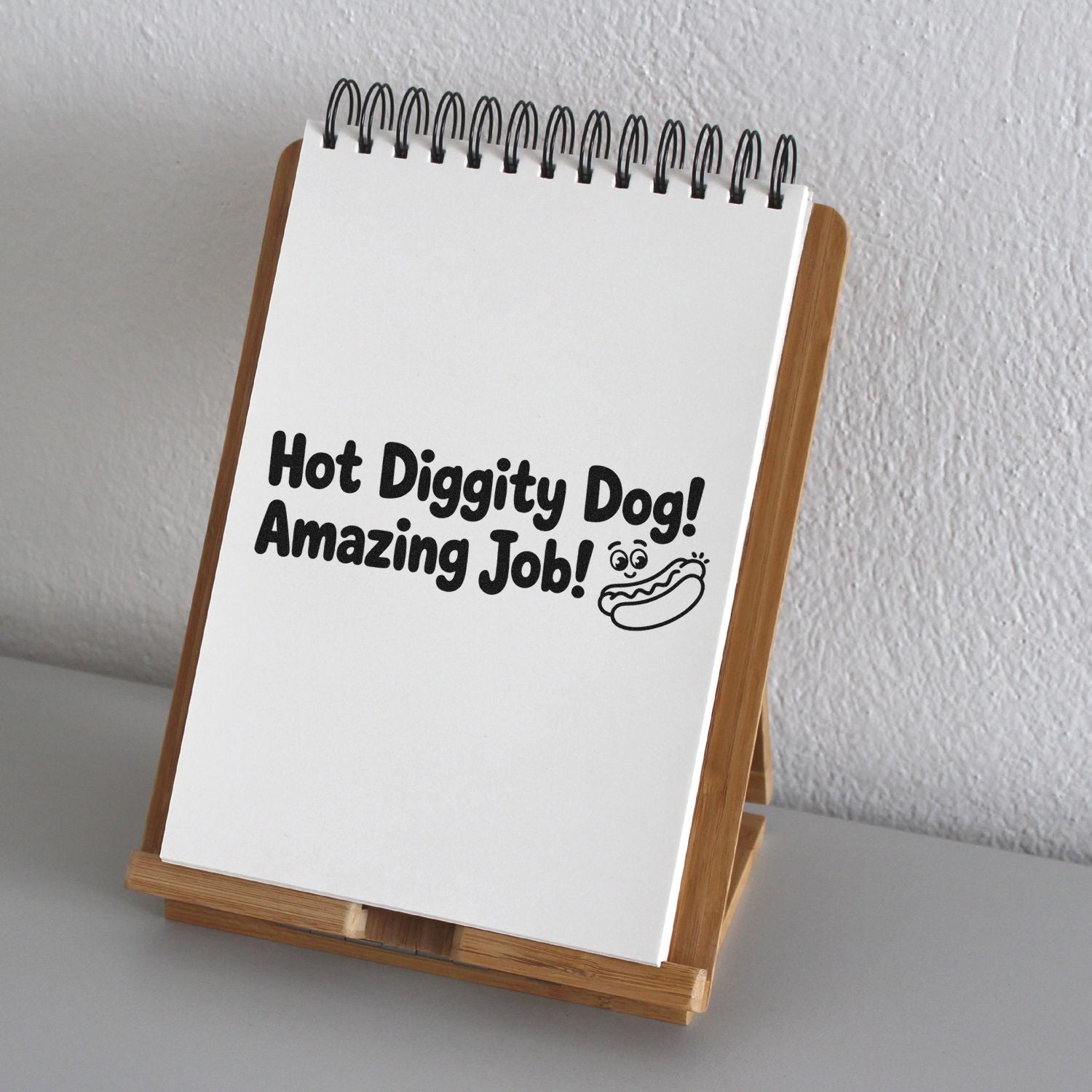 Hot Diggity Dog Amazing Job custom rubber stamp on a spiral notepad, perfect for teacher rewards and dog lovers.