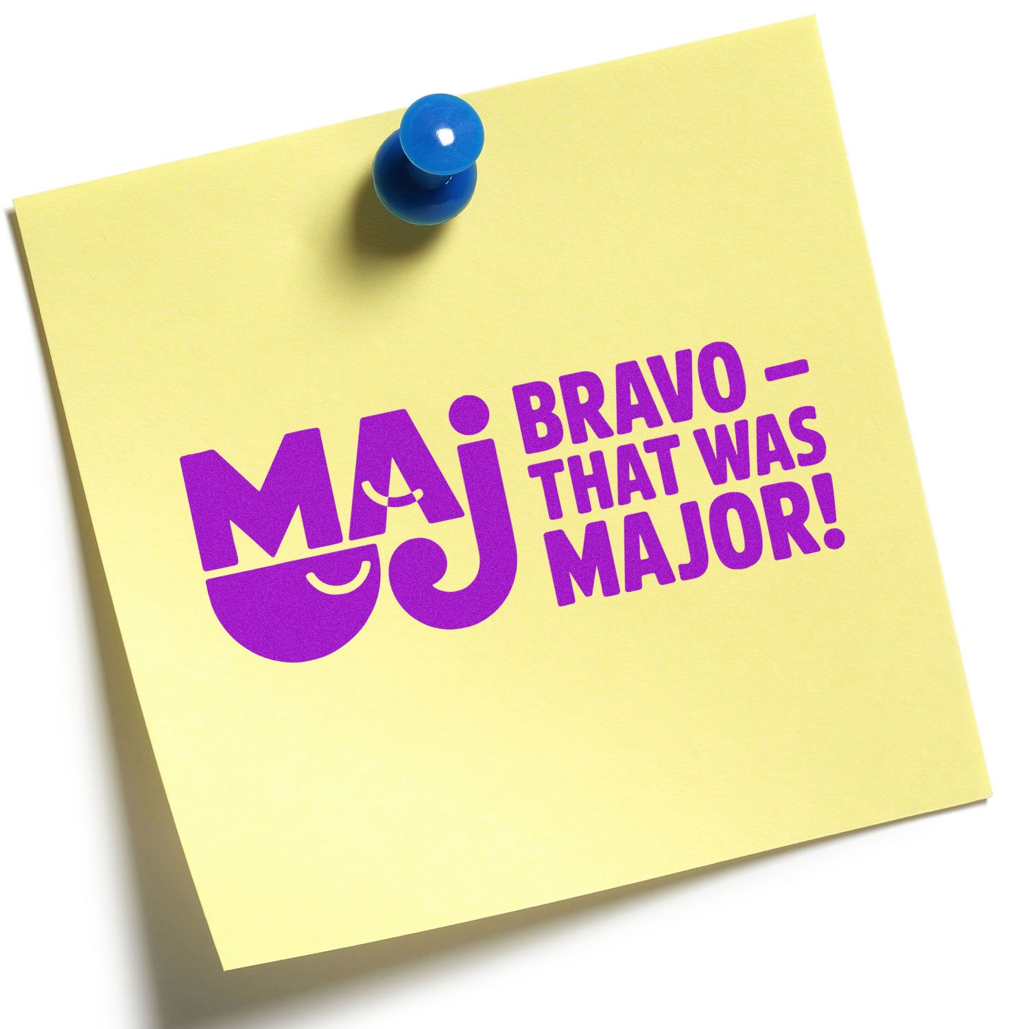 Maj Bravo That Was Major rubber stamp design on yellow sticky note, pinned with a blue pushpin.