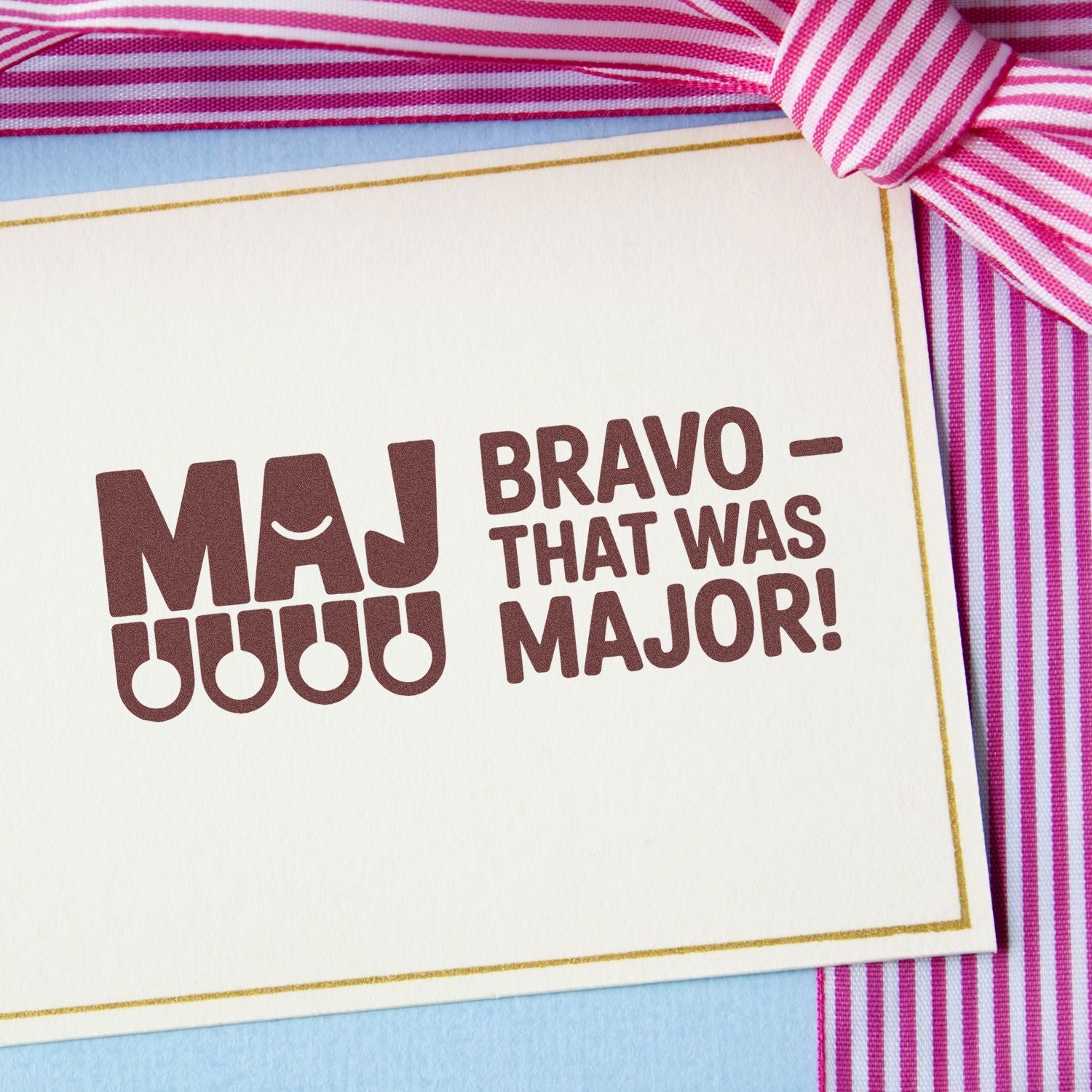 Rubber stamp design with Bravo That Was Major! message for graduation or achievement cards, decorated with a pink ribbon.