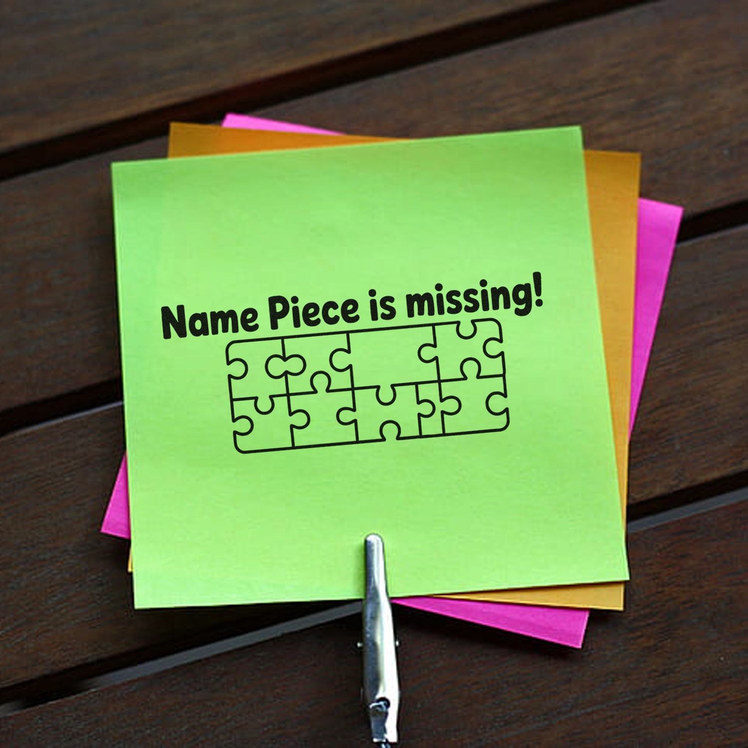Custom rubber stamp reading Name Piece is missing! with puzzle piece graphic on colorful sticky notes.