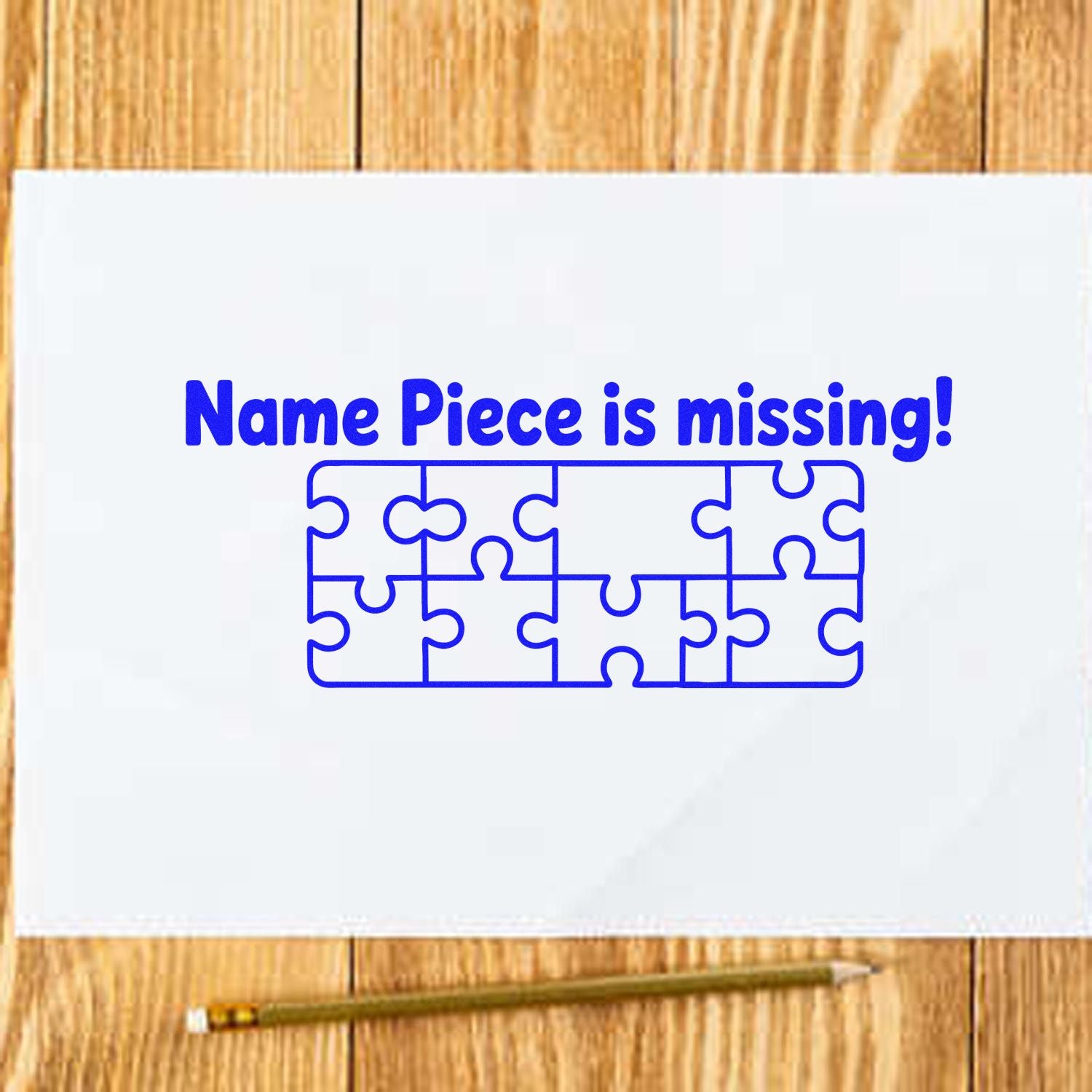 Custom rubber stamp design reading Name Piece is missing! with puzzle piece graphic on white paper.