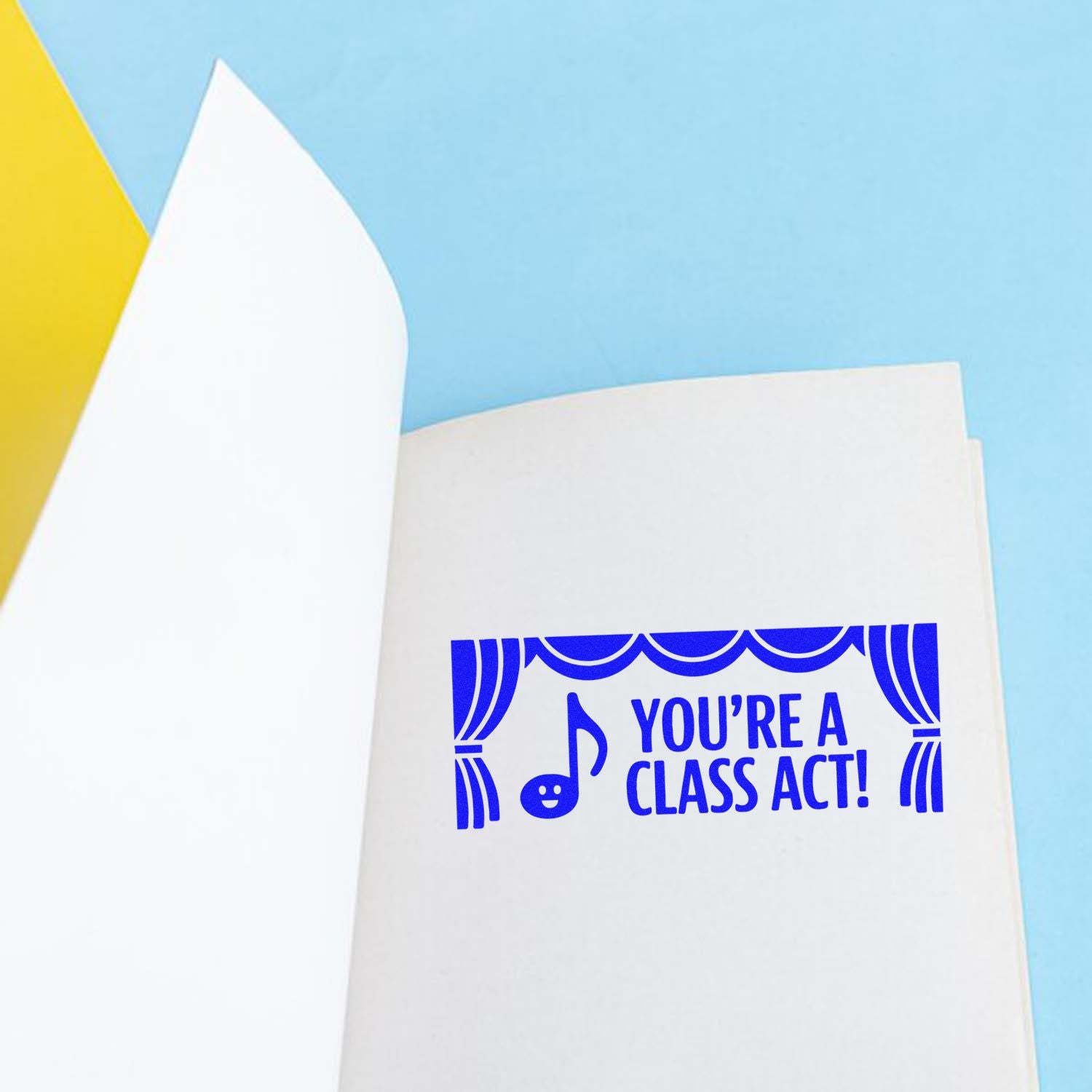 Blue rubber stamp reading Youre a Class Act! for teacher appreciation, music, and theater-themed greeting cards.