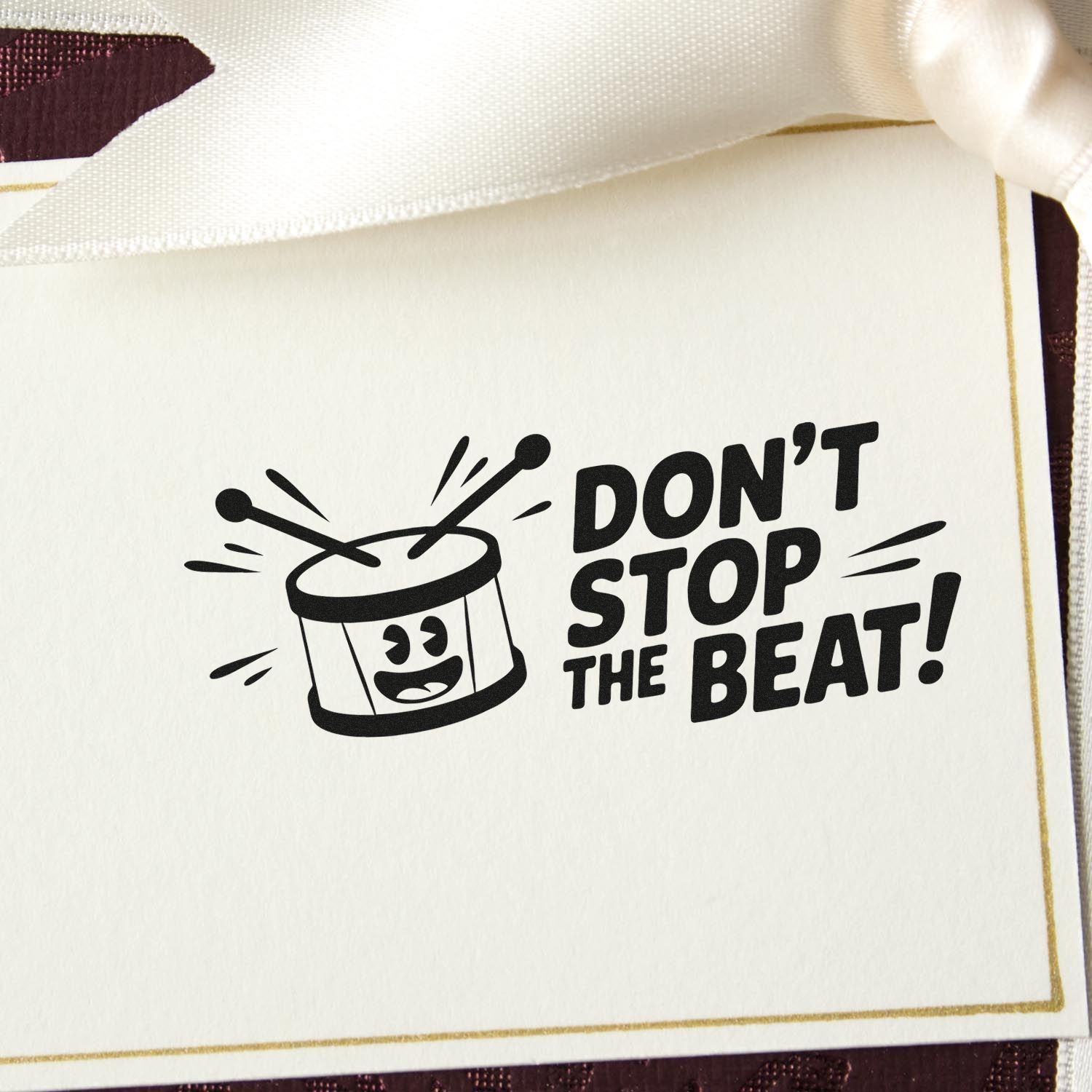 Don't Stop the Beat rubber stamp with drum graphic for music-themed cards, scrapbooking, and handmade crafts.