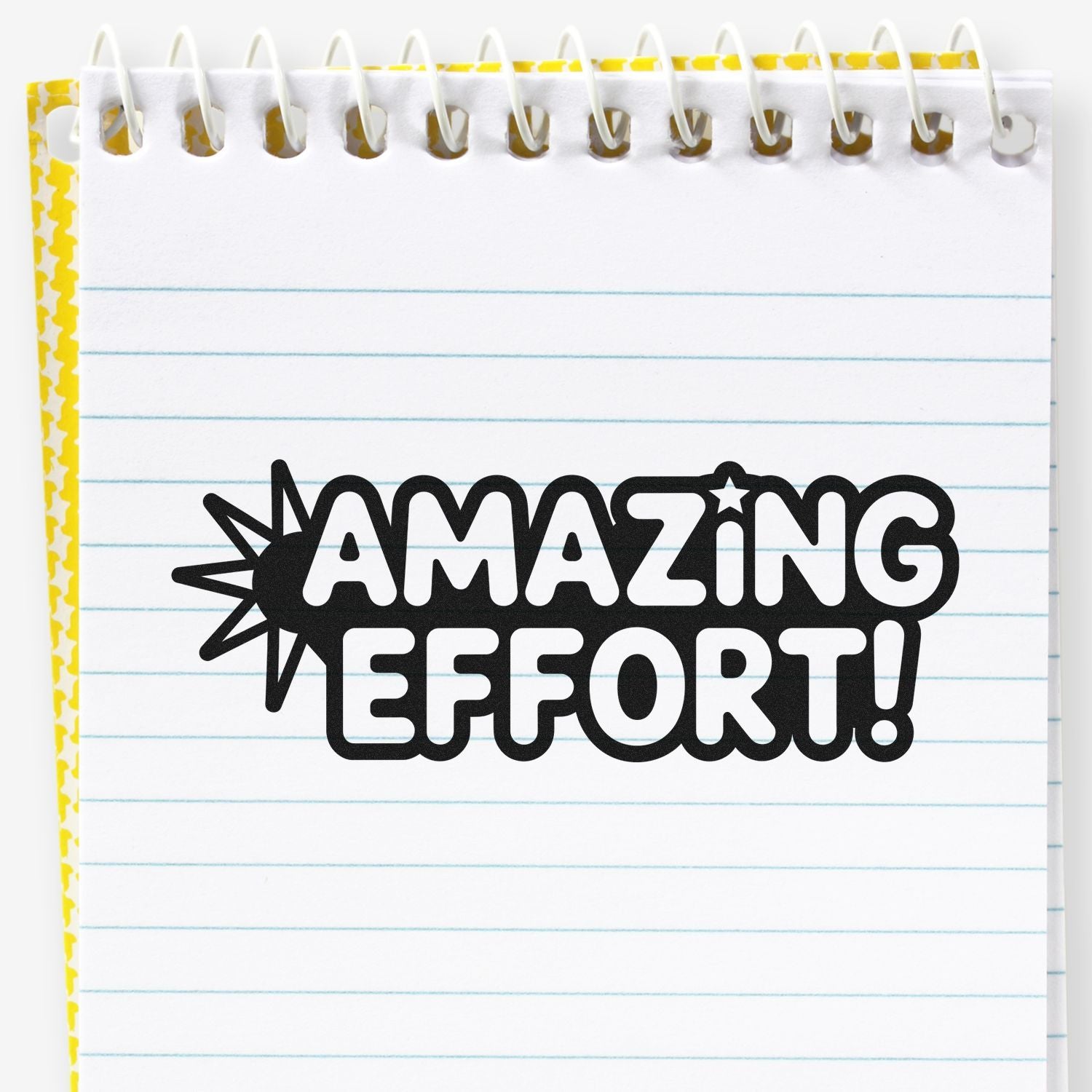 Amazing Effort! rubber stamp on lined notebook page, ideal for teacher rewards, school projects, and motivational stamping.