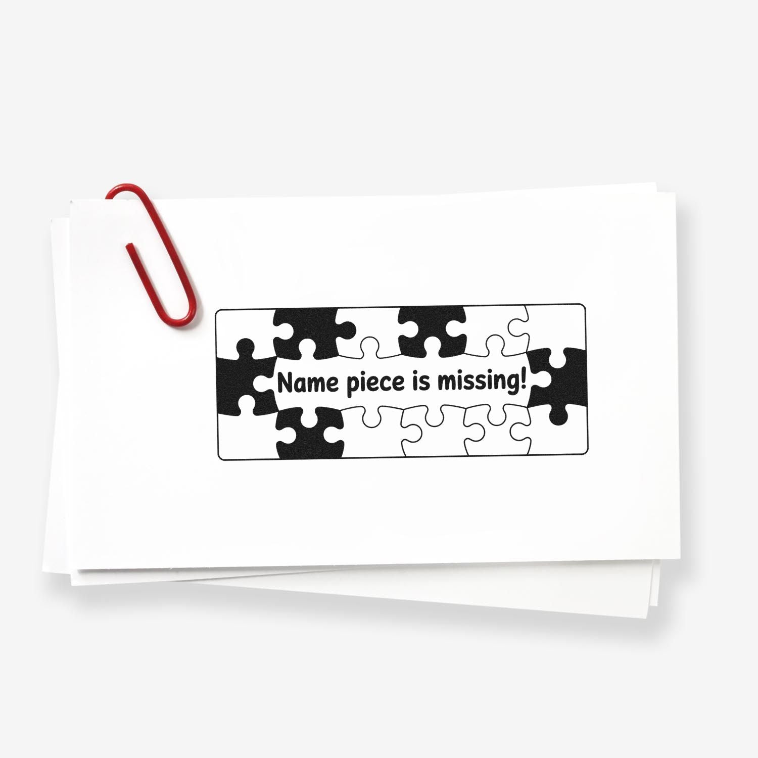 Rubber stamp mockup with puzzle-piece graphic and Name piece is missing! message for classroom or office labeling.