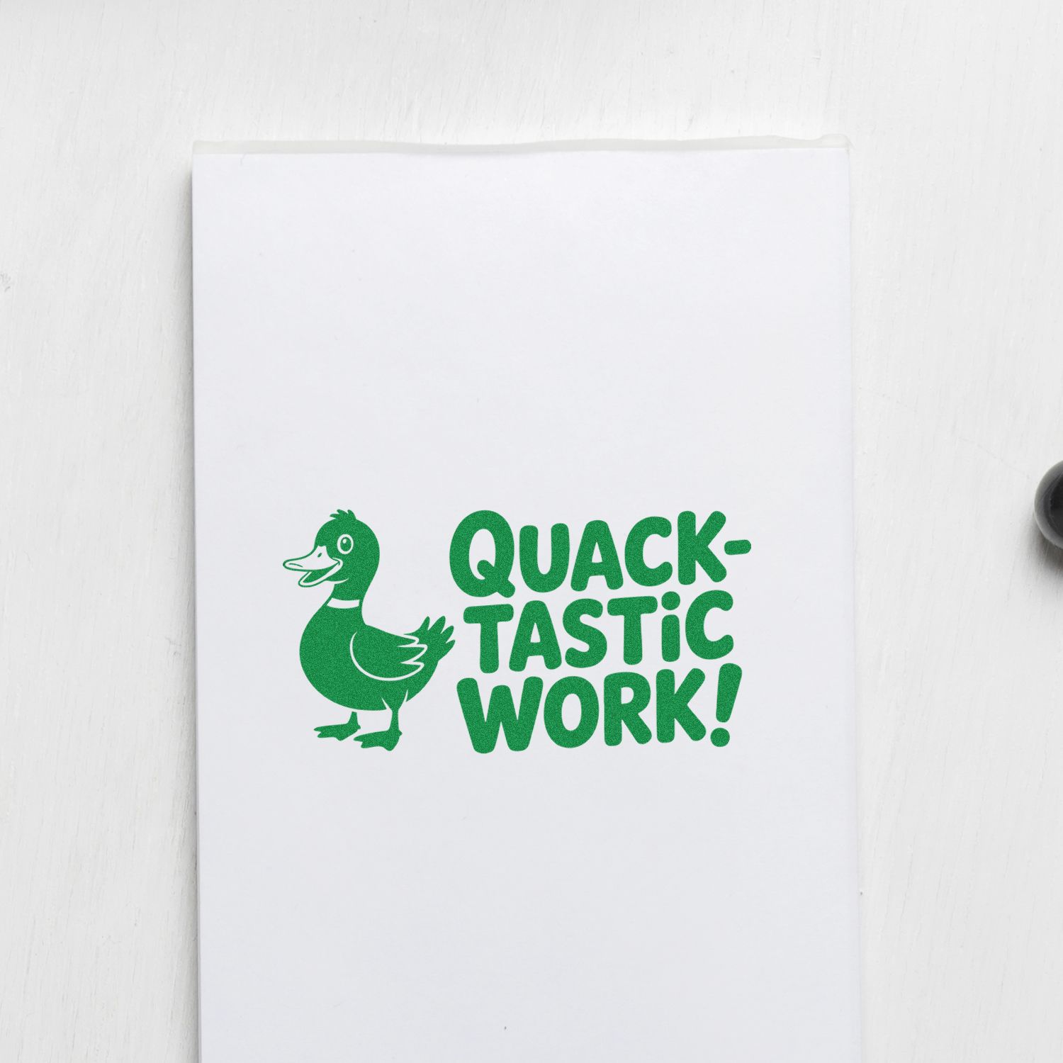 Green duck Quacktastic Work! rubber stamp design on white paper, perfect for teacher reward cards and office notes.