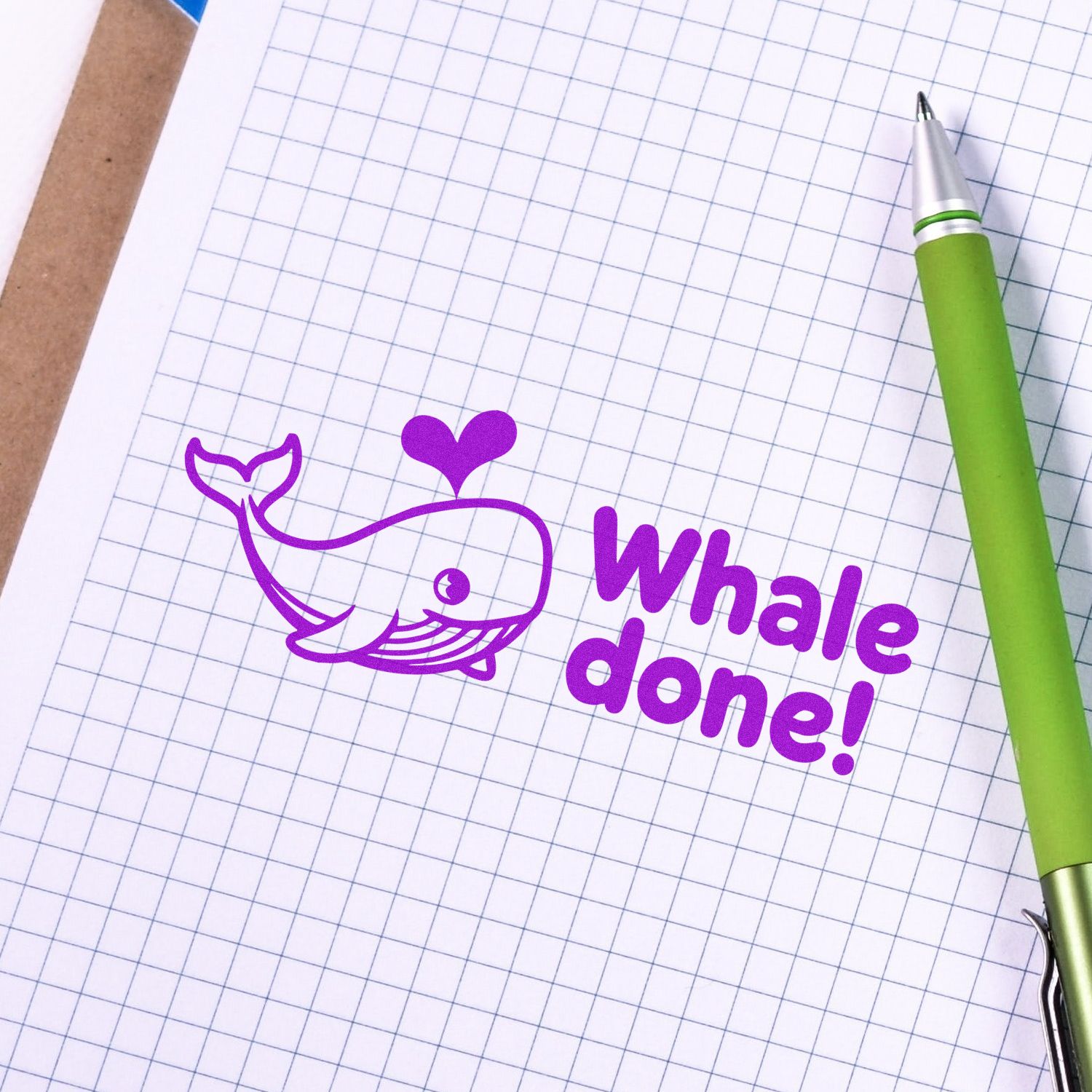 Purple whale rubber stamp design with heart and Whale Done! text for teacher rewards, encouragement, and craft projects.