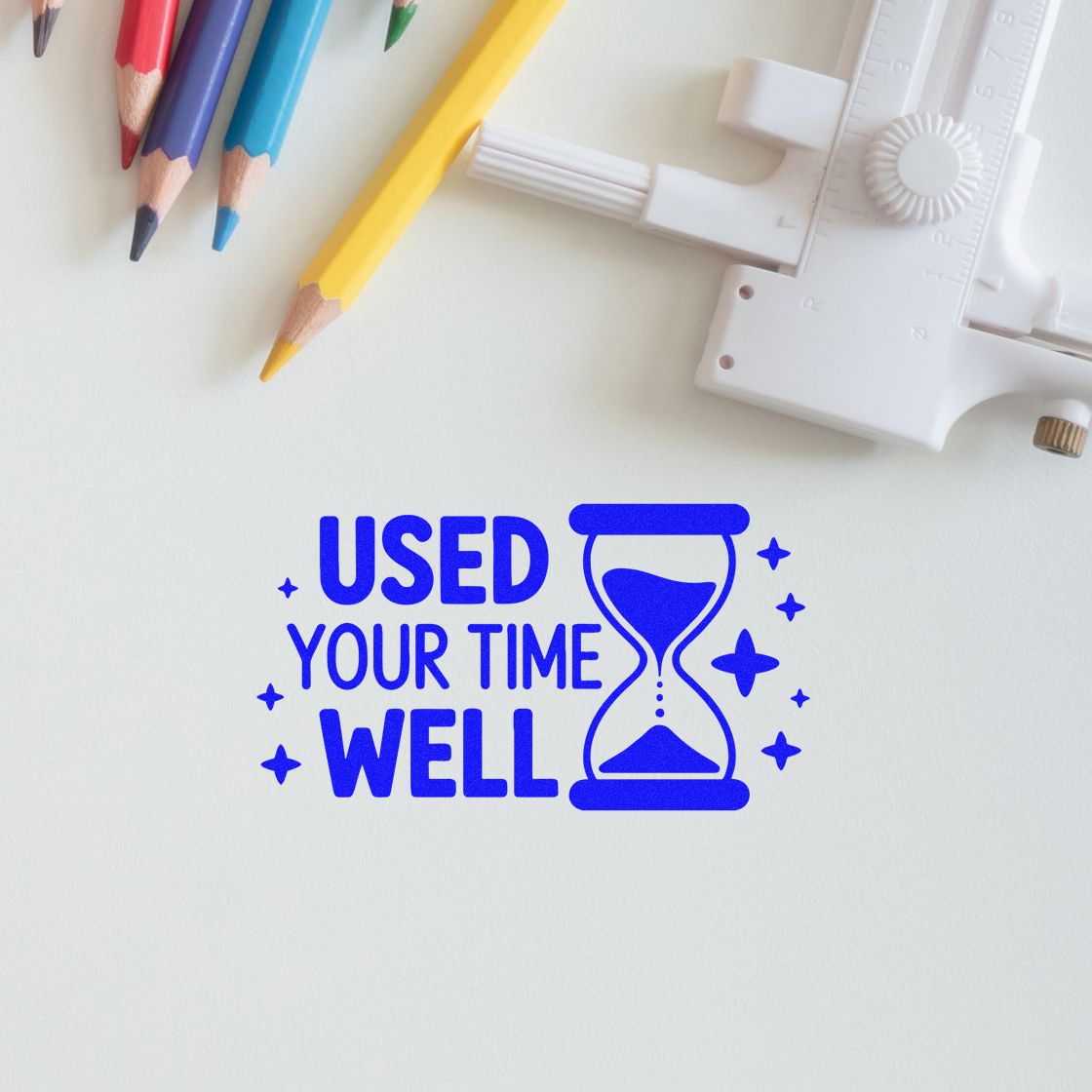Blue custom rubber stamp design reading Used Your Time Well with hourglass, perfect for teacher feedback and office approvals.