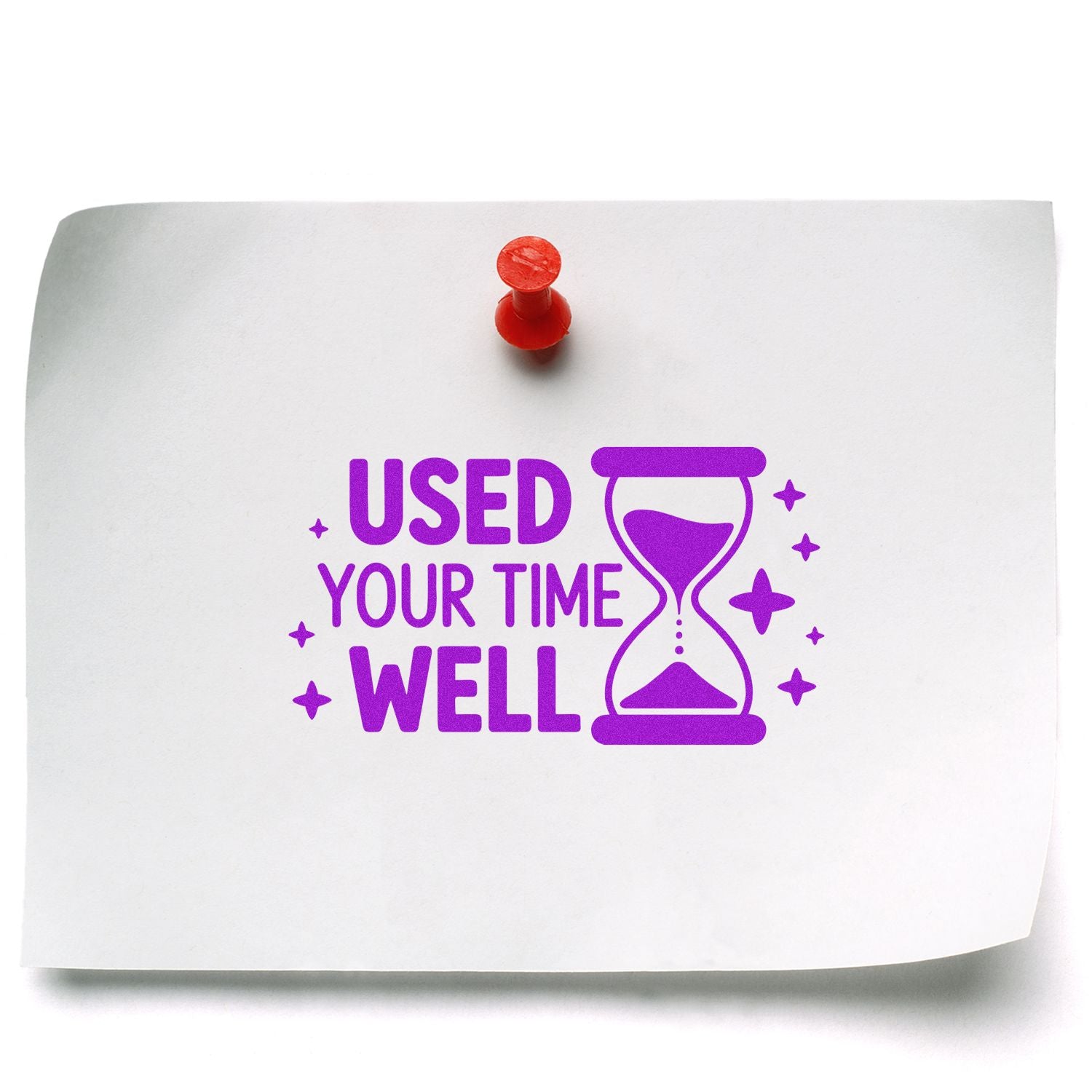 Purple motivational rubber stamp reading Used Your Time Well with hourglass icon on pinned paper for office productivity.