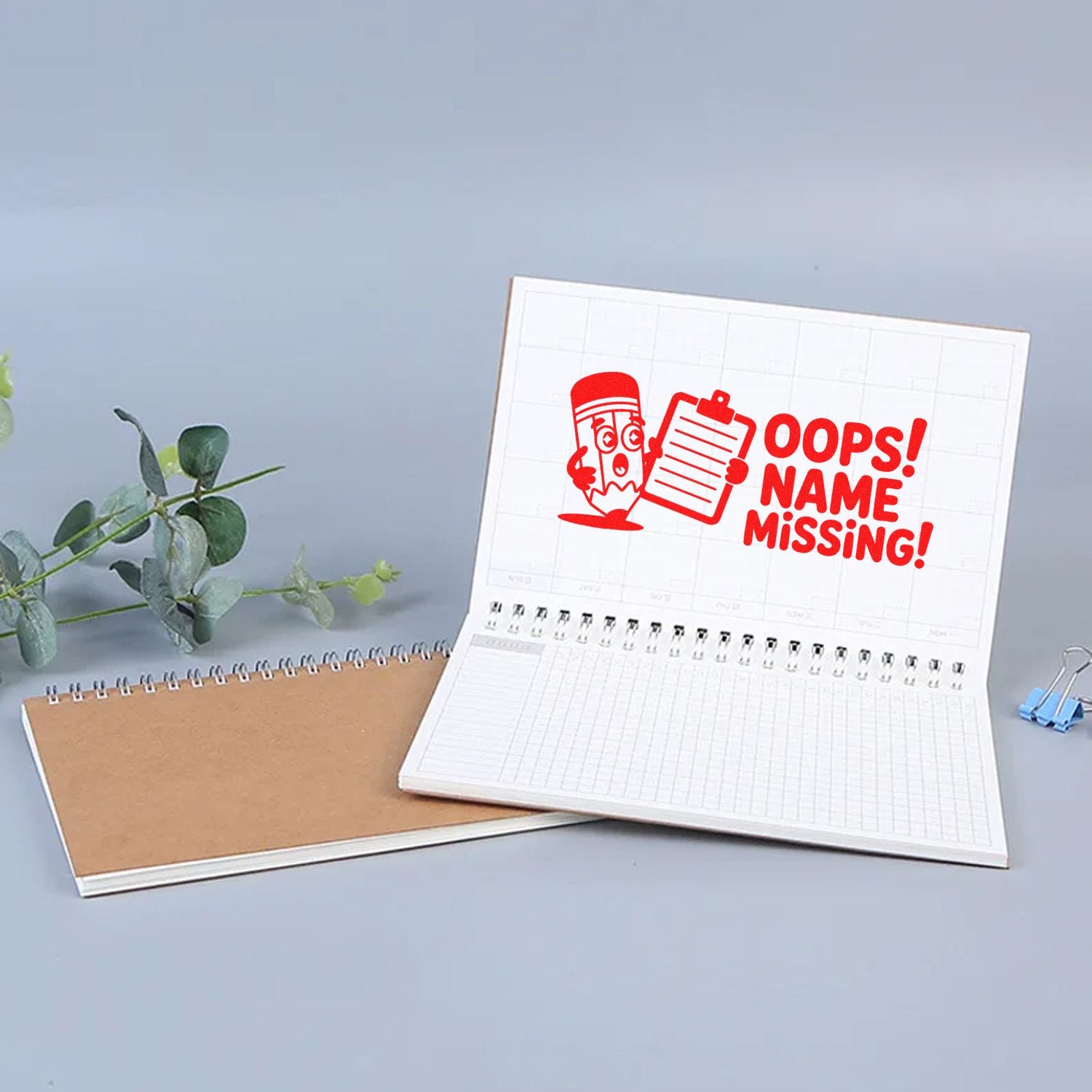 Custom rubber stamp impression reading Oops! Name Missing! for labeling planners, notebooks, and school supplies.