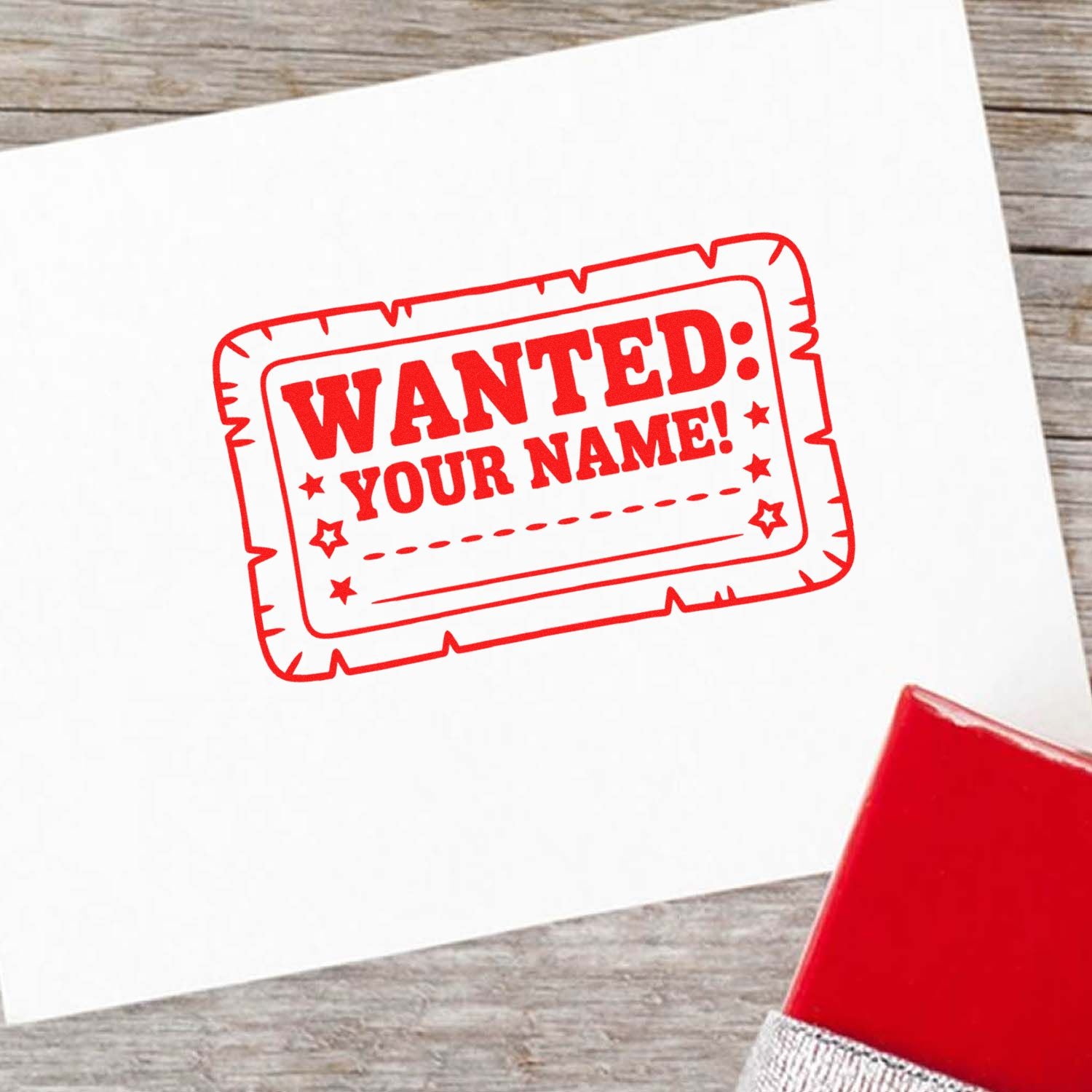 Custom rubber stamp with WANTED: YOUR NAME! design for personalized craft projects, office use, and novelty stamping.