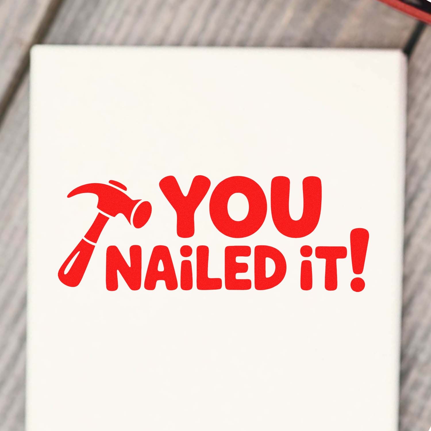 Custom rubber stamp design with hammer icon and You Nailed It! text for office, teacher, reward, and DIY projects.