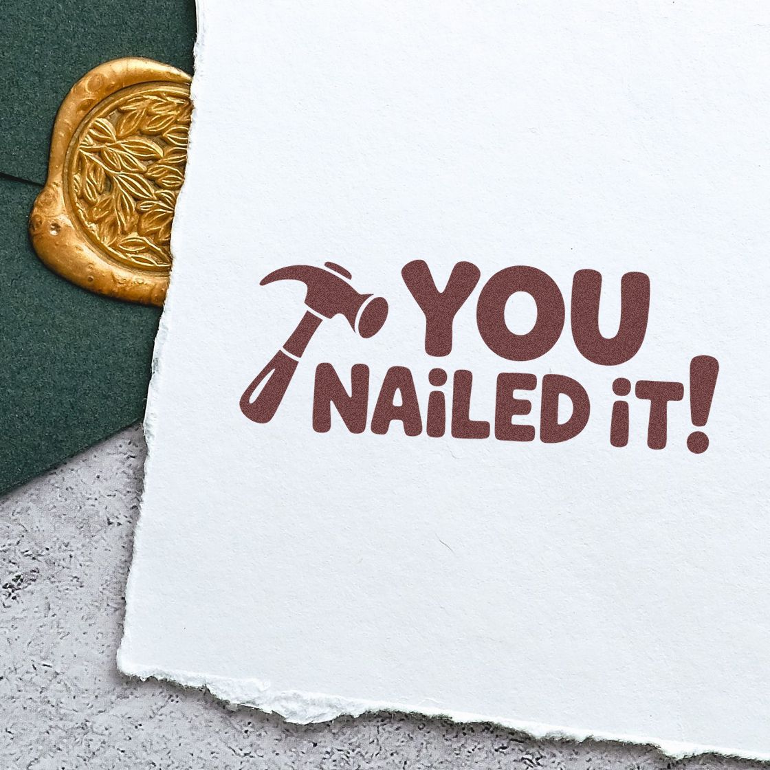 You nailed it! custom rubber stamp impression with hammer icon on paper, perfect for congratulatory crafts and branding.