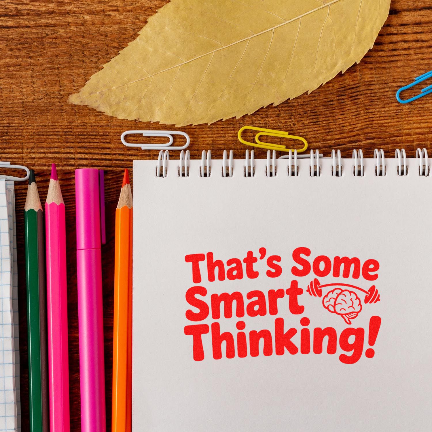 Rubber stamp reading Thats Some Smart Thinking! for classroom or office use, with brain icon and stationery.