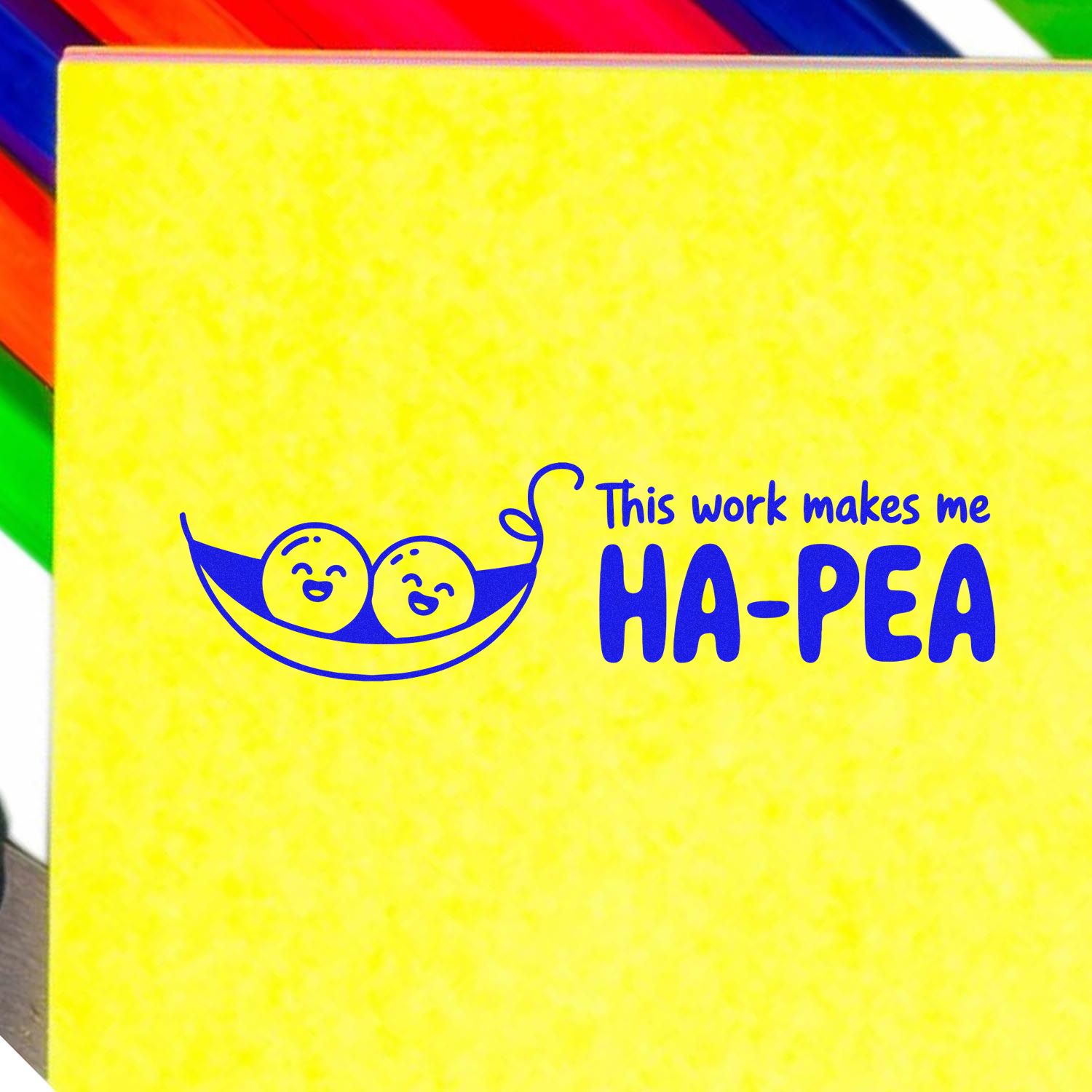 Custom rubber stamp design with peas in a pod and the phrase This work makes me HA-PEA on a yellow background.