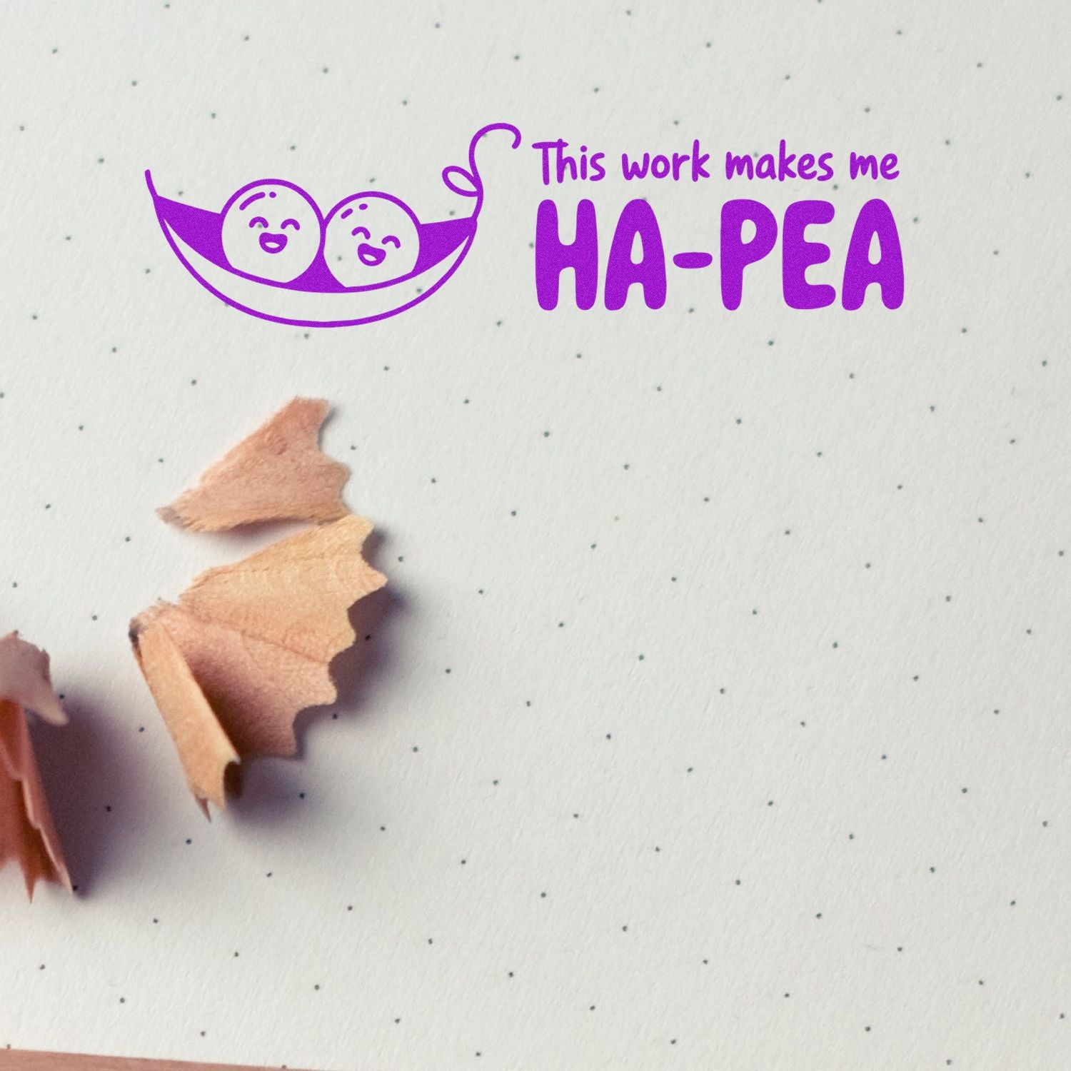 Funny rubber stamp saying This work makes me HA-PEA with smiling pea pod, ideal for playful office stationery.