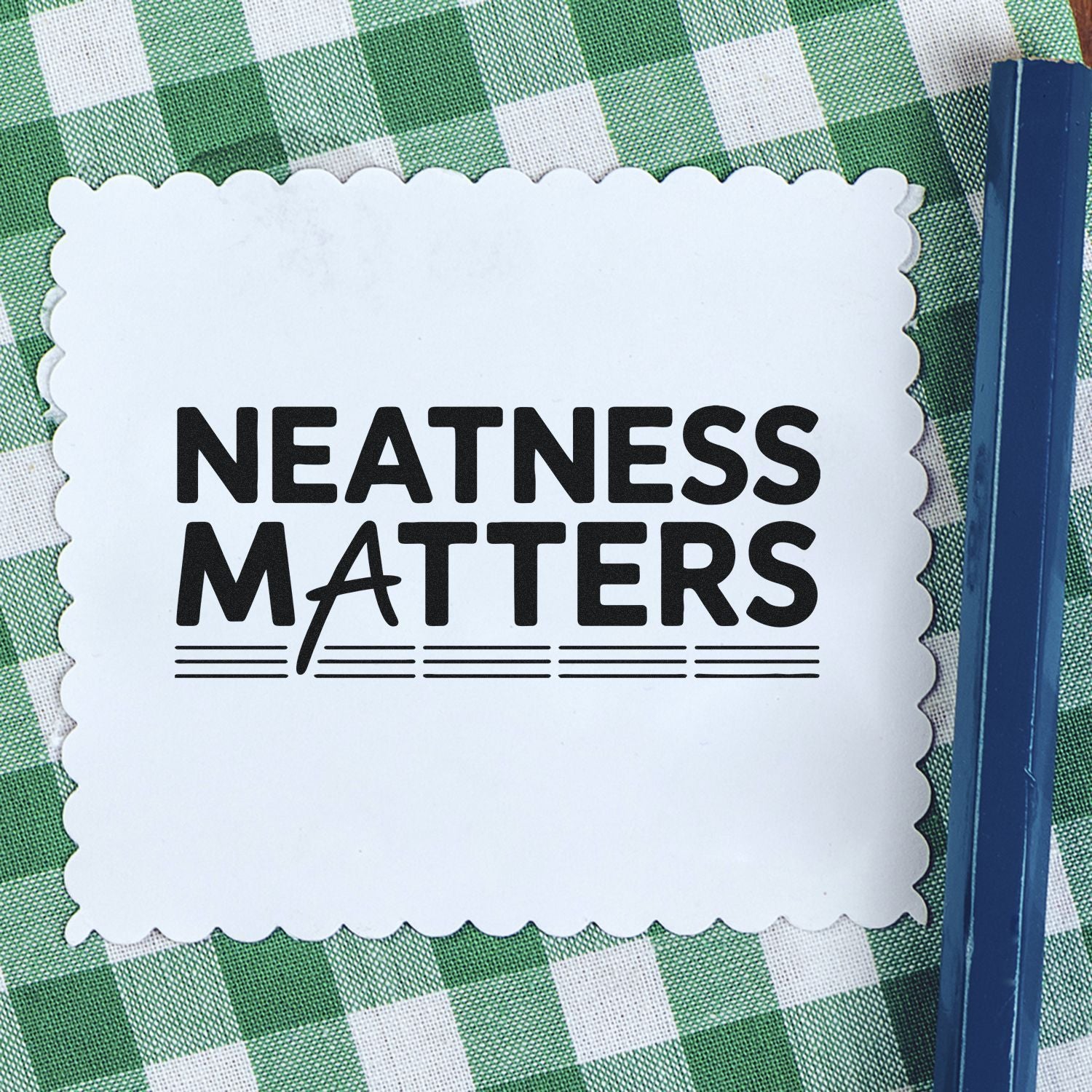 Neatness Matters rubber stamp impression on scalloped card, ideal for crafting, stationery, and organization.