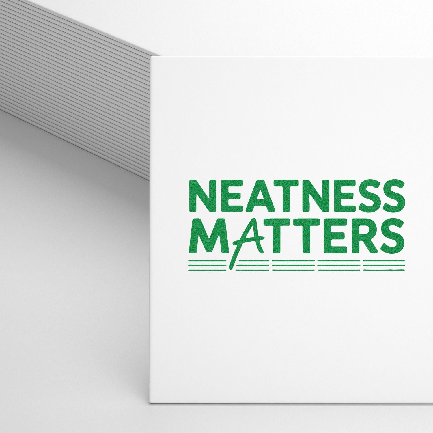 Custom rubber stamp mockup with green Neatness Matters design for stationery, office branding, and organization.