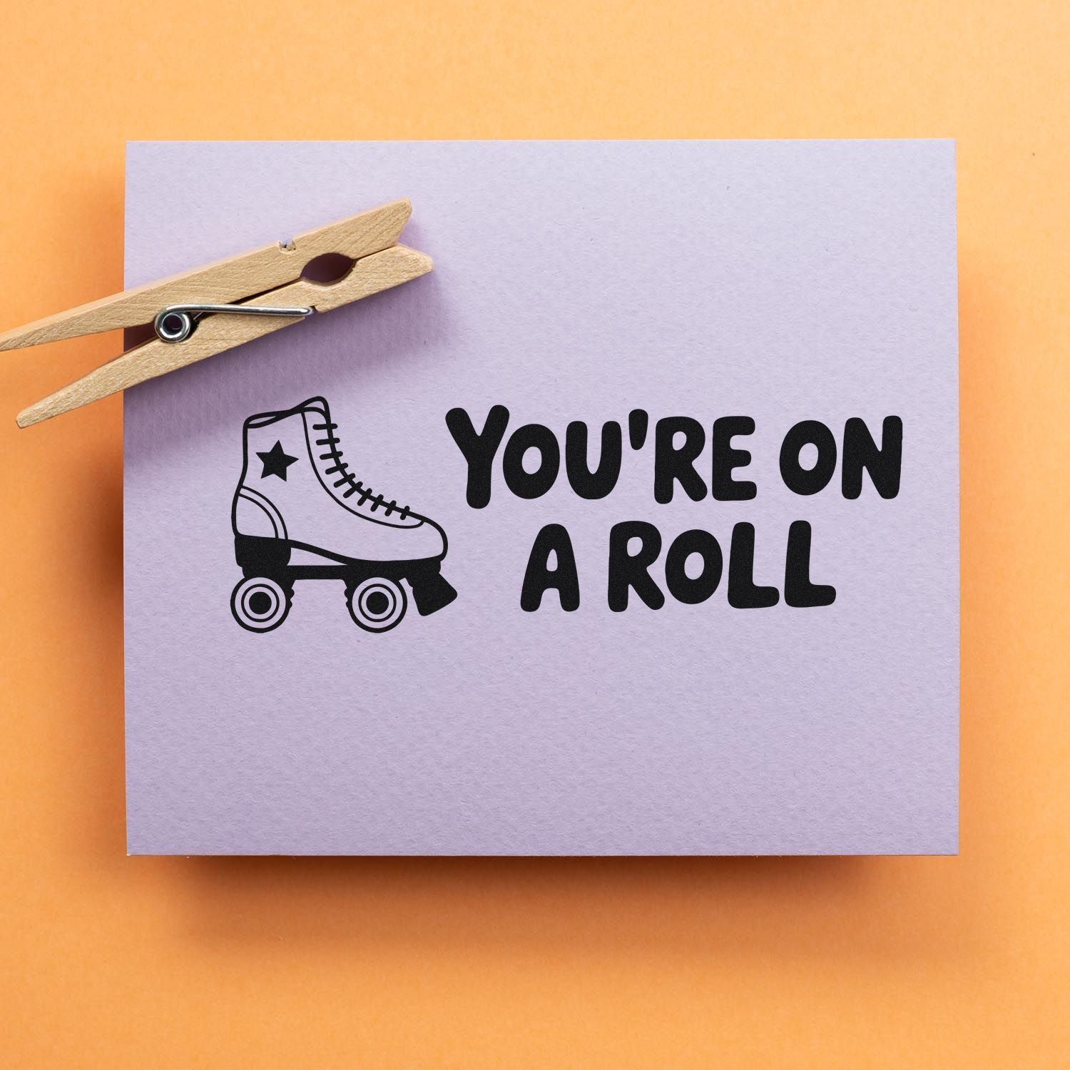 Roller skate rubber stamp design reading Youre on a Roll for DIY stationery, craft projects, and inspirational cards.