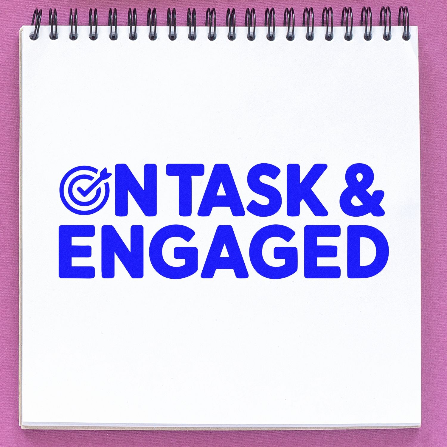 On Task & Engaged rubber stamp design in blue on a notebook page, ideal for teacher productivity and classroom motivation.