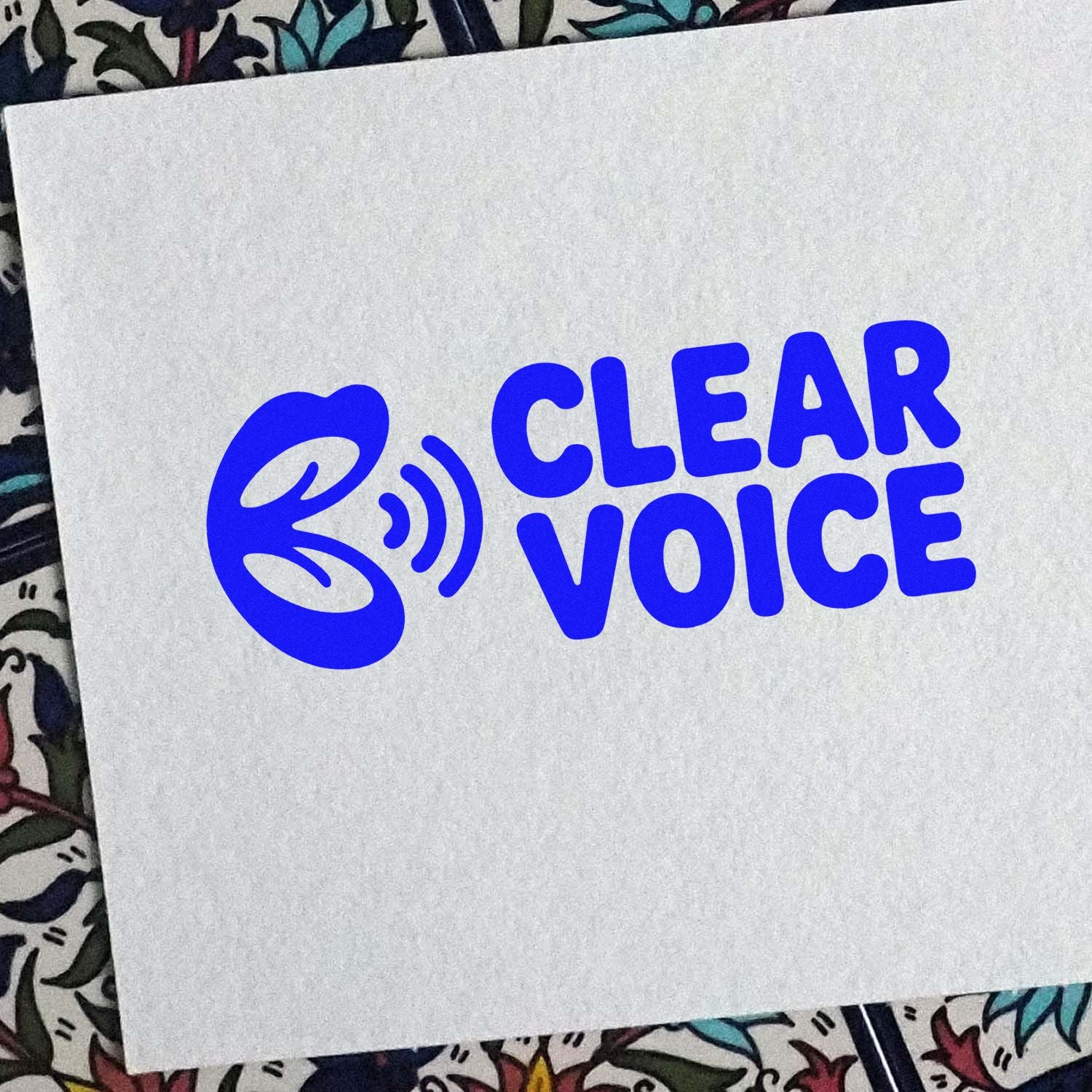 Clear Voice custom rubber stamp logo impression in bold blue on white paper for branding.