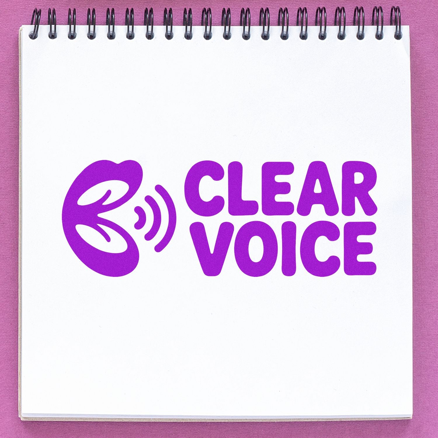 Purple Clear Voice rubber stamp design with ear and sound waves, perfect for speech therapy and communication branding.
