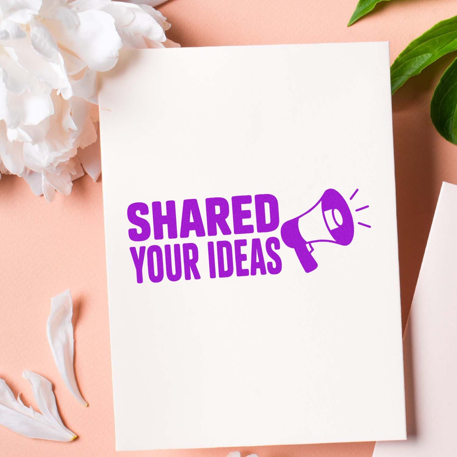 Purple Shared Your Ideas rubber stamp with megaphone icon on white card, ideal for feedback and promotion.
