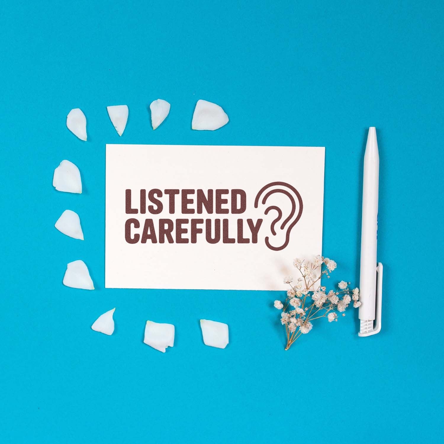 Rubber stamp mockup reading Listened Carefully? with ear icon, ideal for office feedback and teacher marking.
