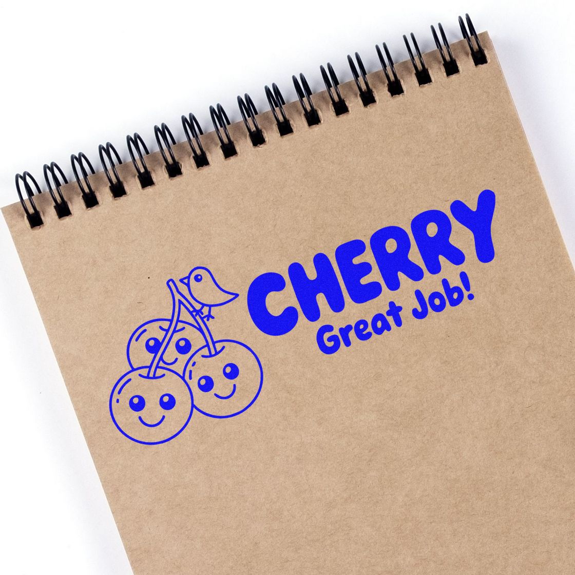 Cherry rubber stamp with Great Job! on a spiral notebook, ideal for teacher rewards, office feedback, and craft projects.