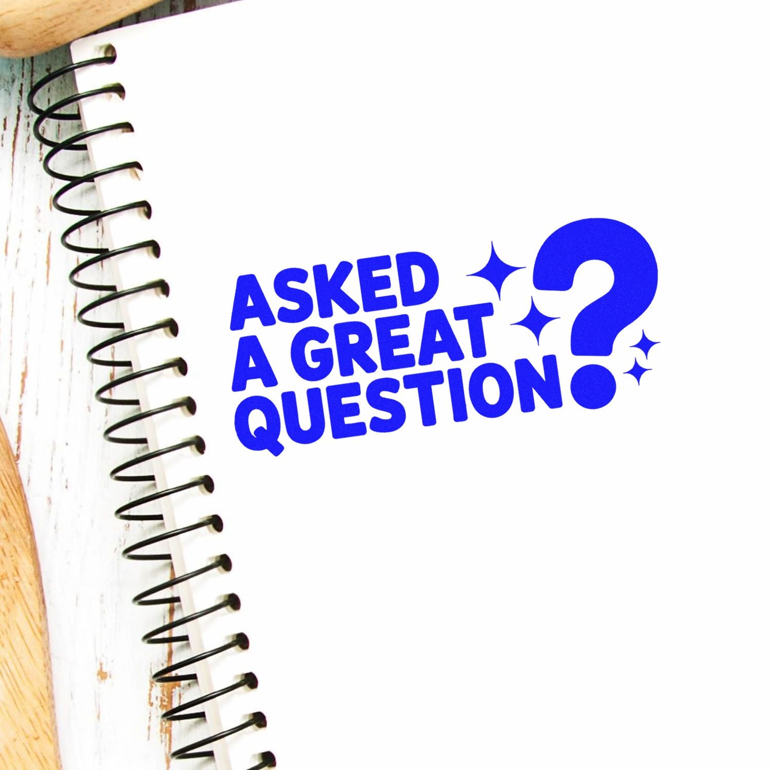 Asked a Great Question rubber stamp design in bold blue on a notebook page, ideal for teacher feedback and classroom rewards.