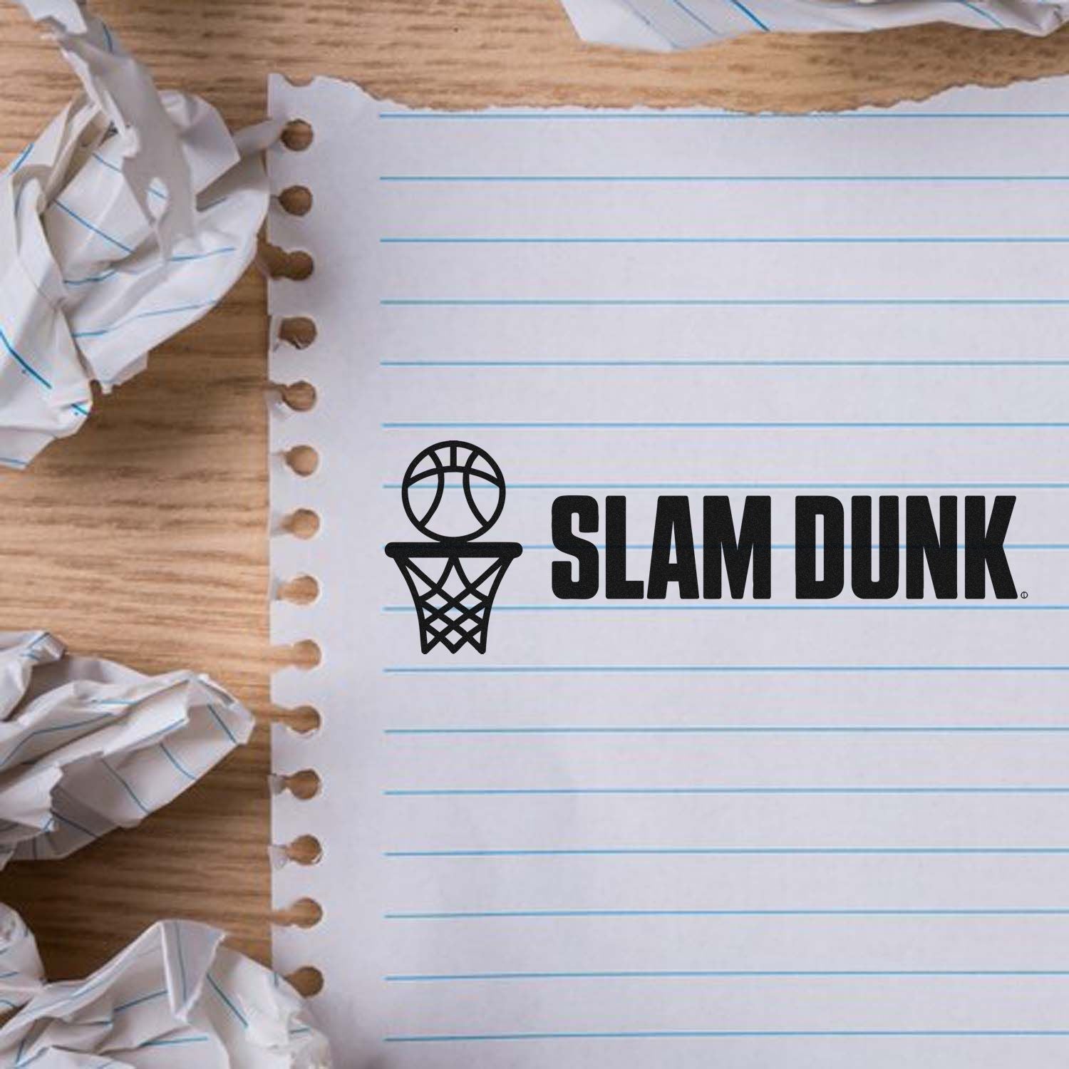 Slam Dunk basketball rubber stamp design on lined notebook paper, perfect for sports-themed custom stamps.