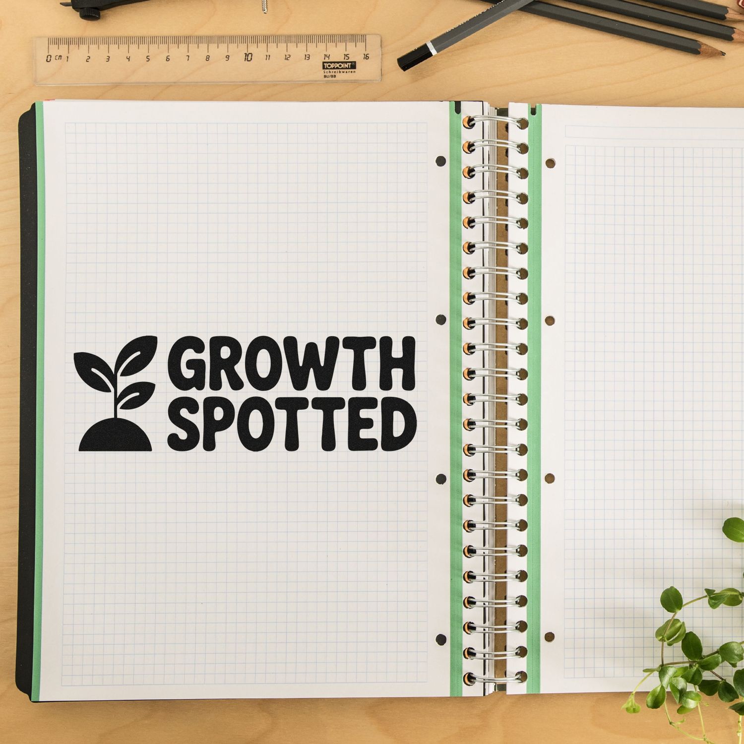 Growth Spotted rubber stamp impression in a notebook, ideal for plant growth tracking, gardening journals, and classroom projects.