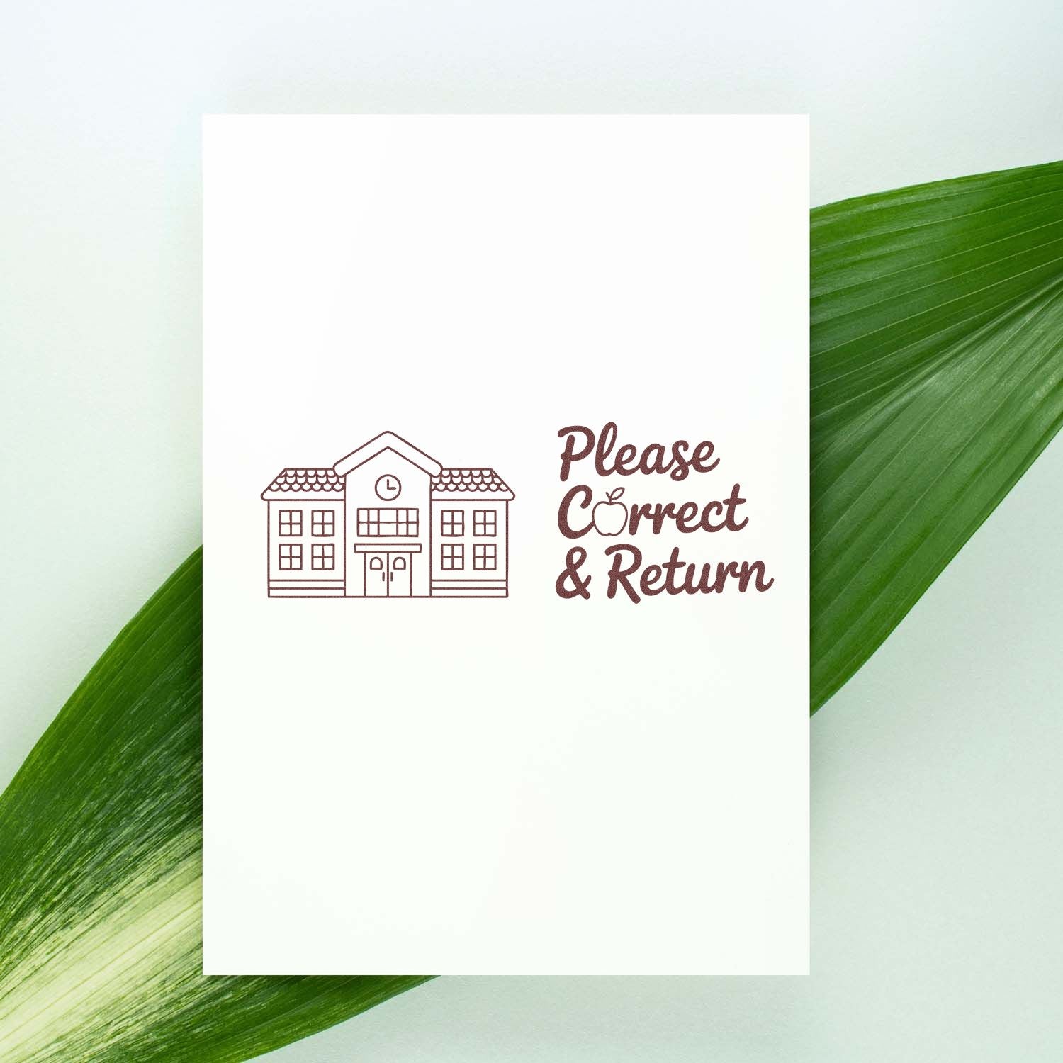 School return address rubber stamp design with Please Correct & Return text and classroom building icon.
