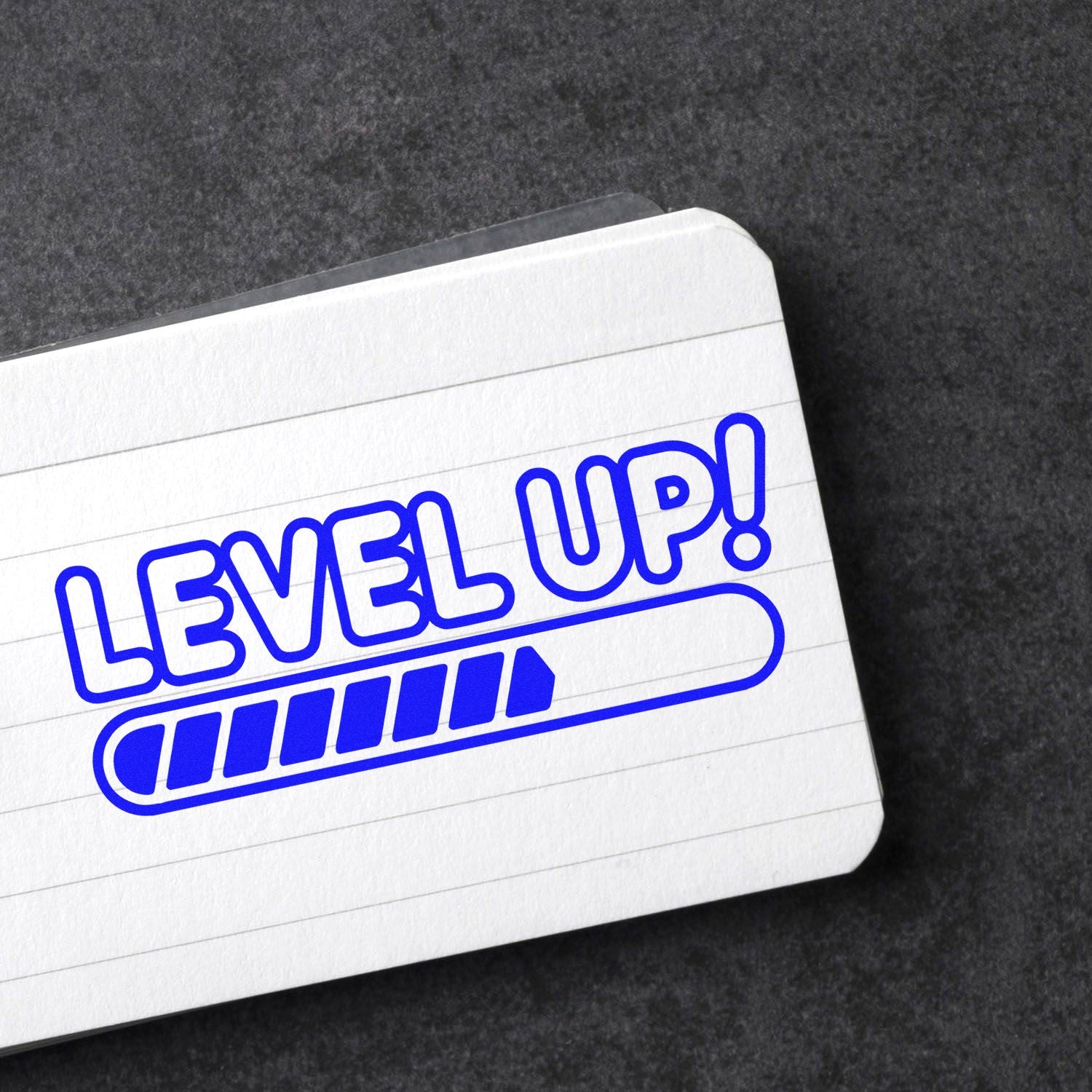 Level Up! rubber stamp design with progress bar, ideal for motivational branding and business growth.