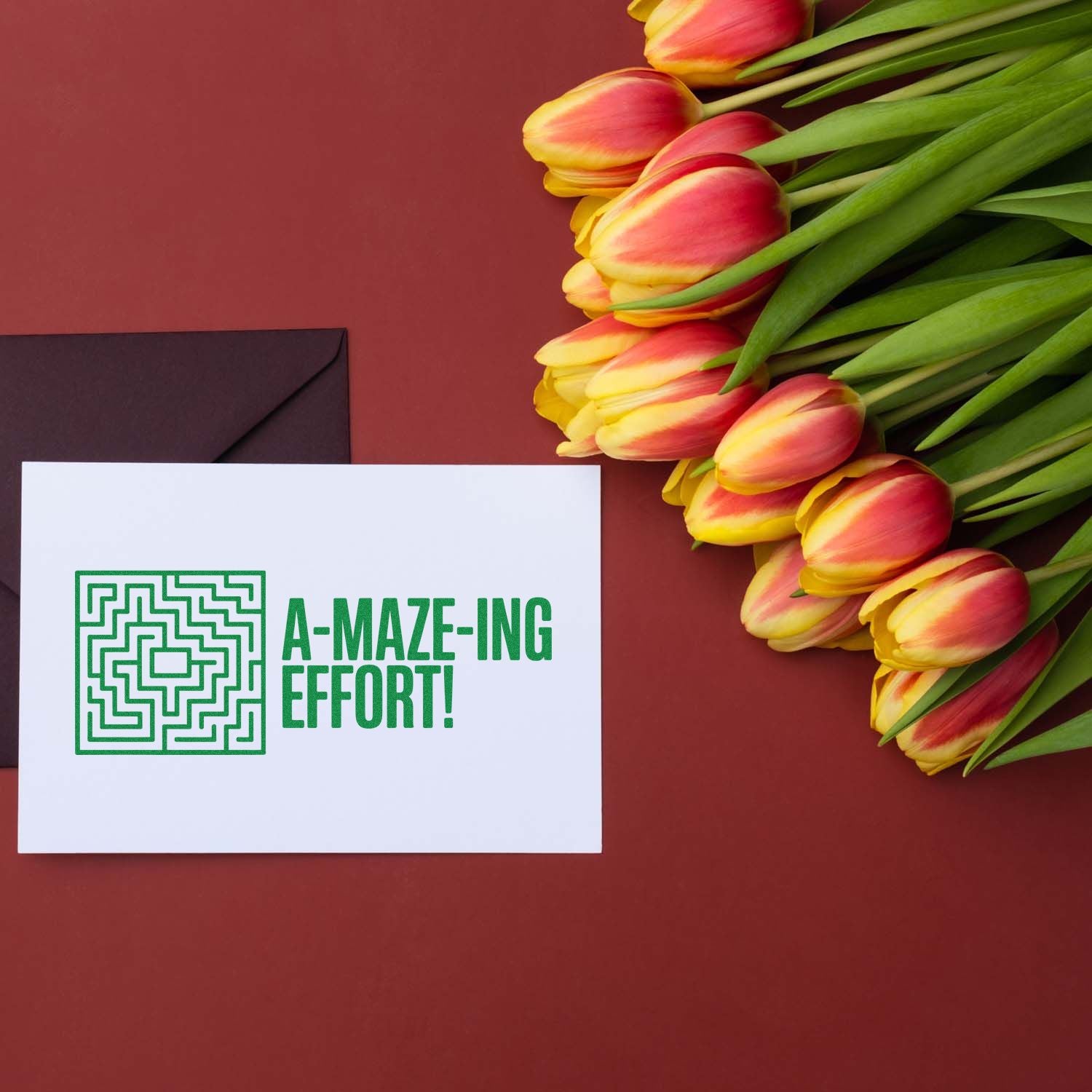 Custom rubber stamp design reading A-MAZE-ING EFFORT! on a card, styled with tulips and envelope for thank-you gifts.