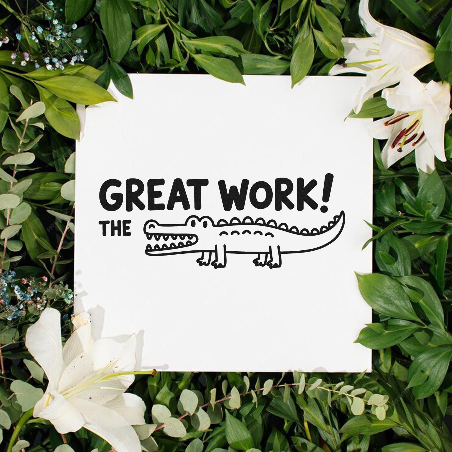 Great Work! alligator rubber stamp for teacher rewards, shown on white paper with floral greenery backdrop