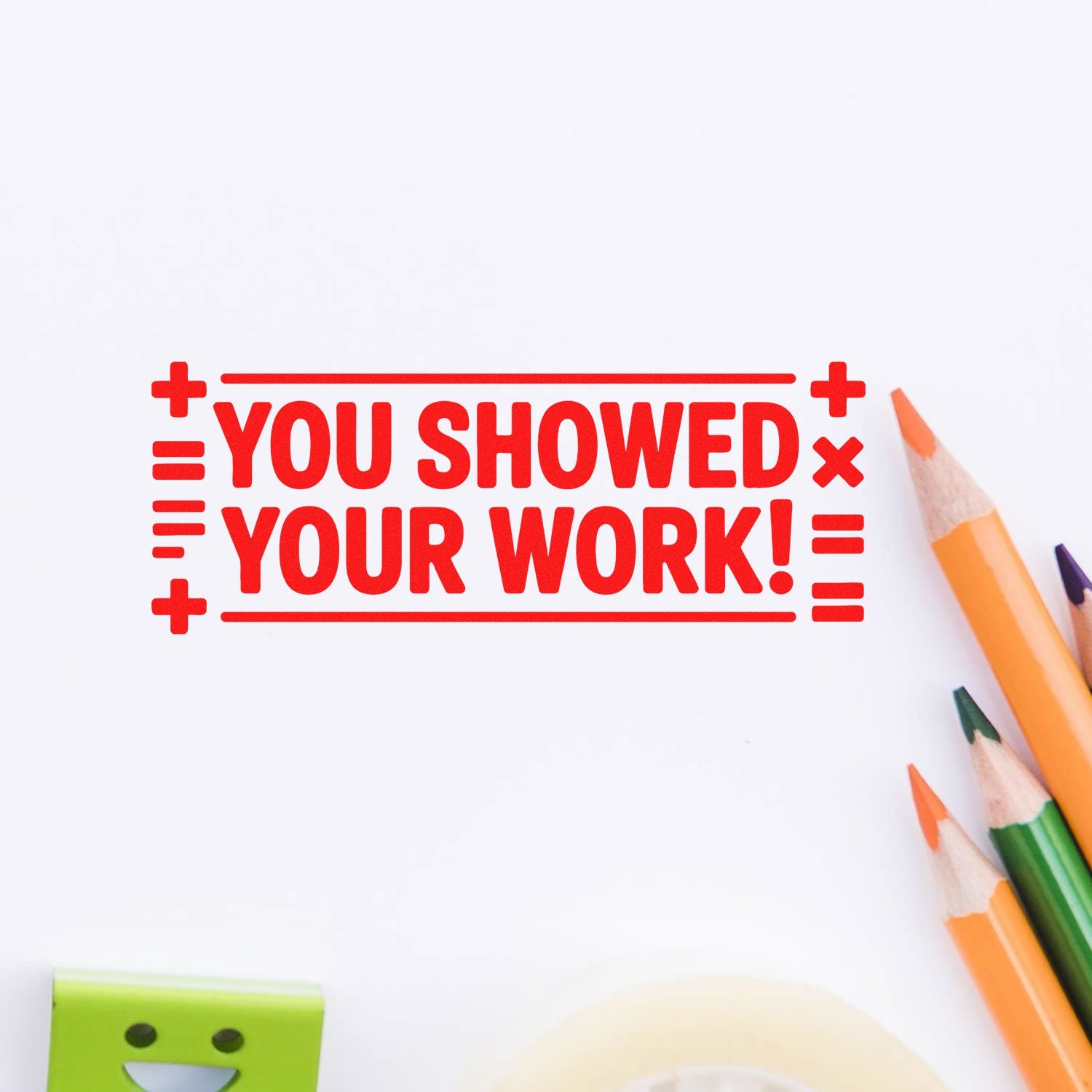 Red teacher rubber stamp reading You showed your work! with colored pencils on a white background for grading and classroom use.
