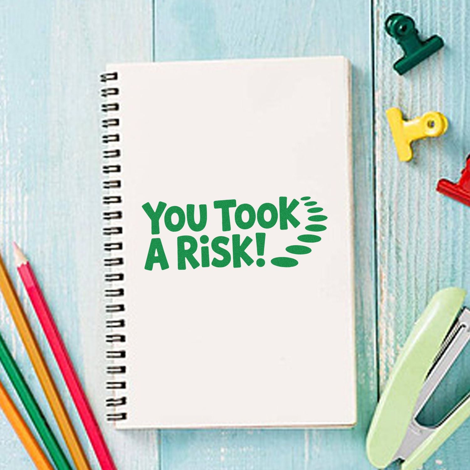 You Took a Risk! rubber stamp on spiral notebook, perfect for teacher feedback, journaling, and school stationery.